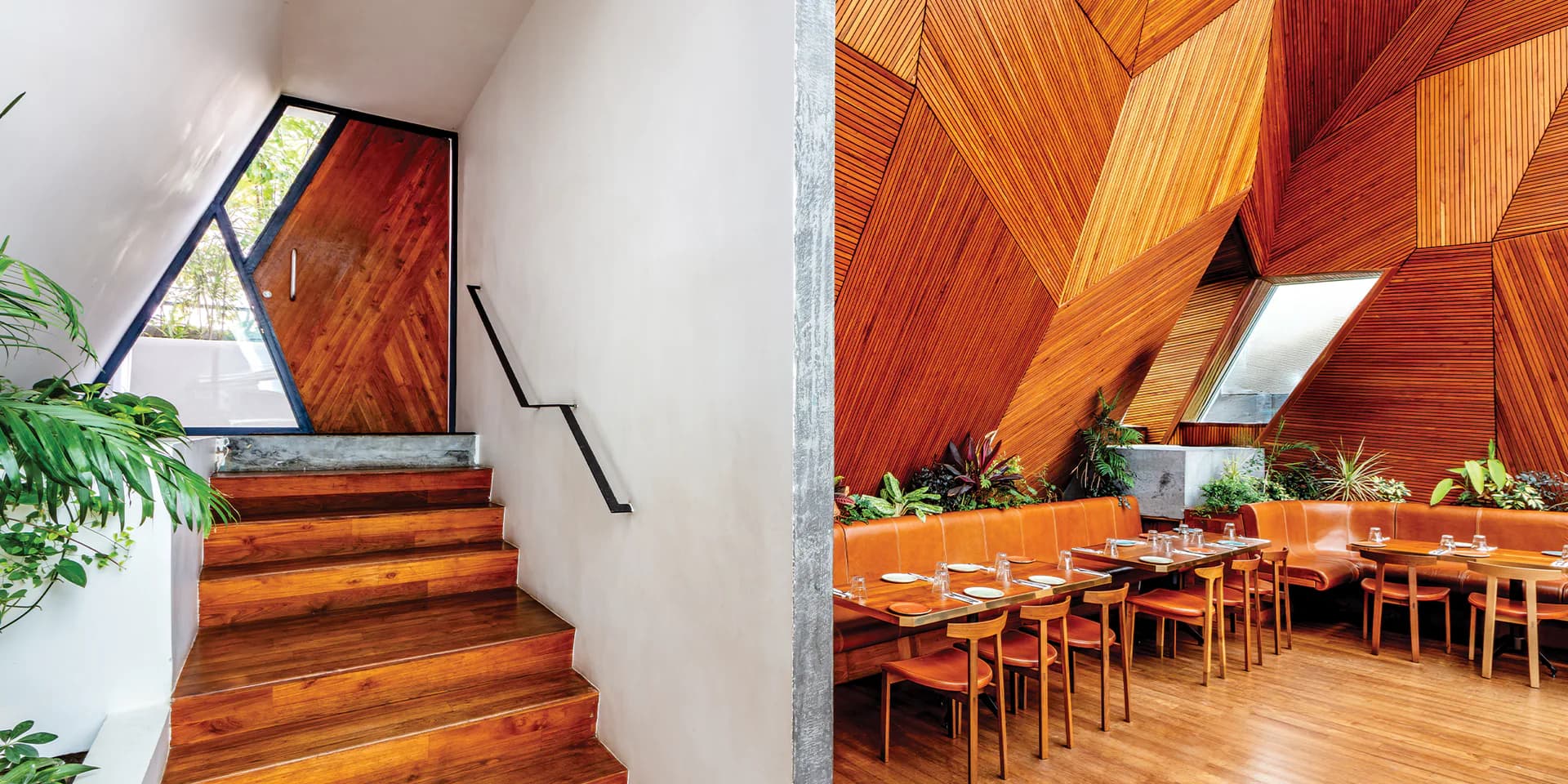 Modern wooden dining space with angular timber ceiling, large windows, warm wood tones, and dining tables by Zhixiao Yu.