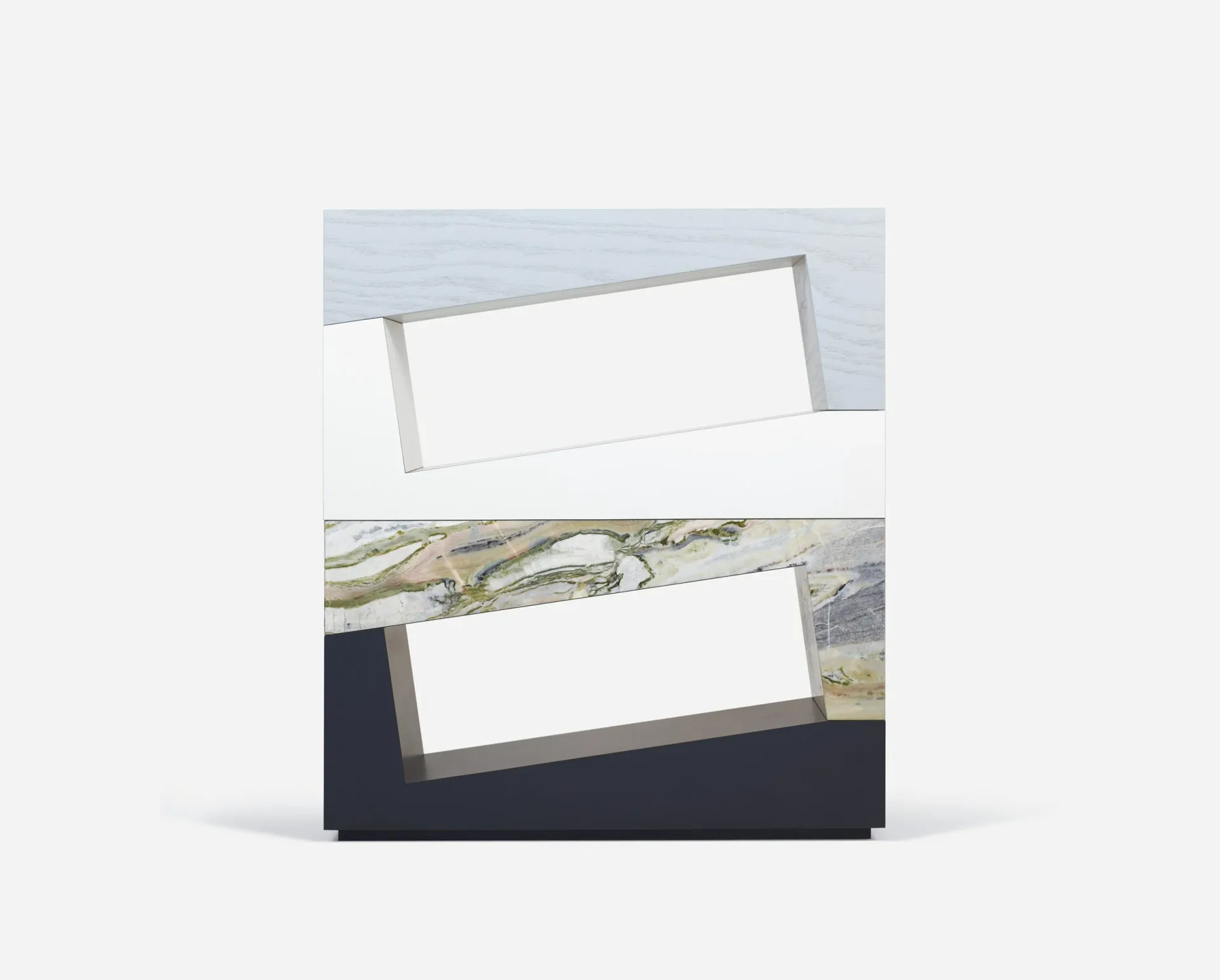 Layered material samples displaying blue, cream, patterned, and dark navy tones arranged in an overlapping composition by Zoë Mowat.
