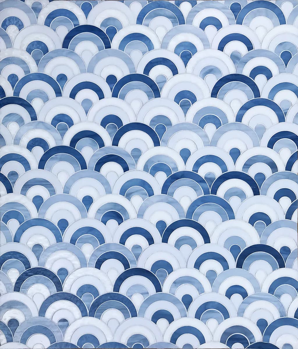 Abstract geometric pattern of overlapping semicircles in varying shades of blue and white, creating a layered, wave-like design by Allison Eden Studios.