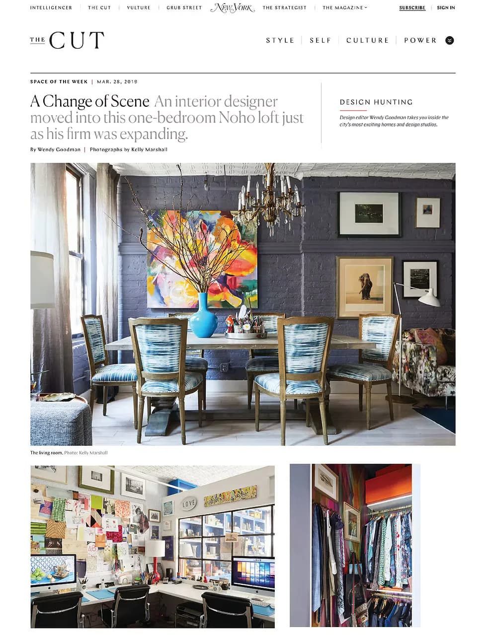 Modern Noho loft dining area with dark charcoal walls, colorful abstract painting, brass-framed chairs, and curated gallery wall by Apartment 48.