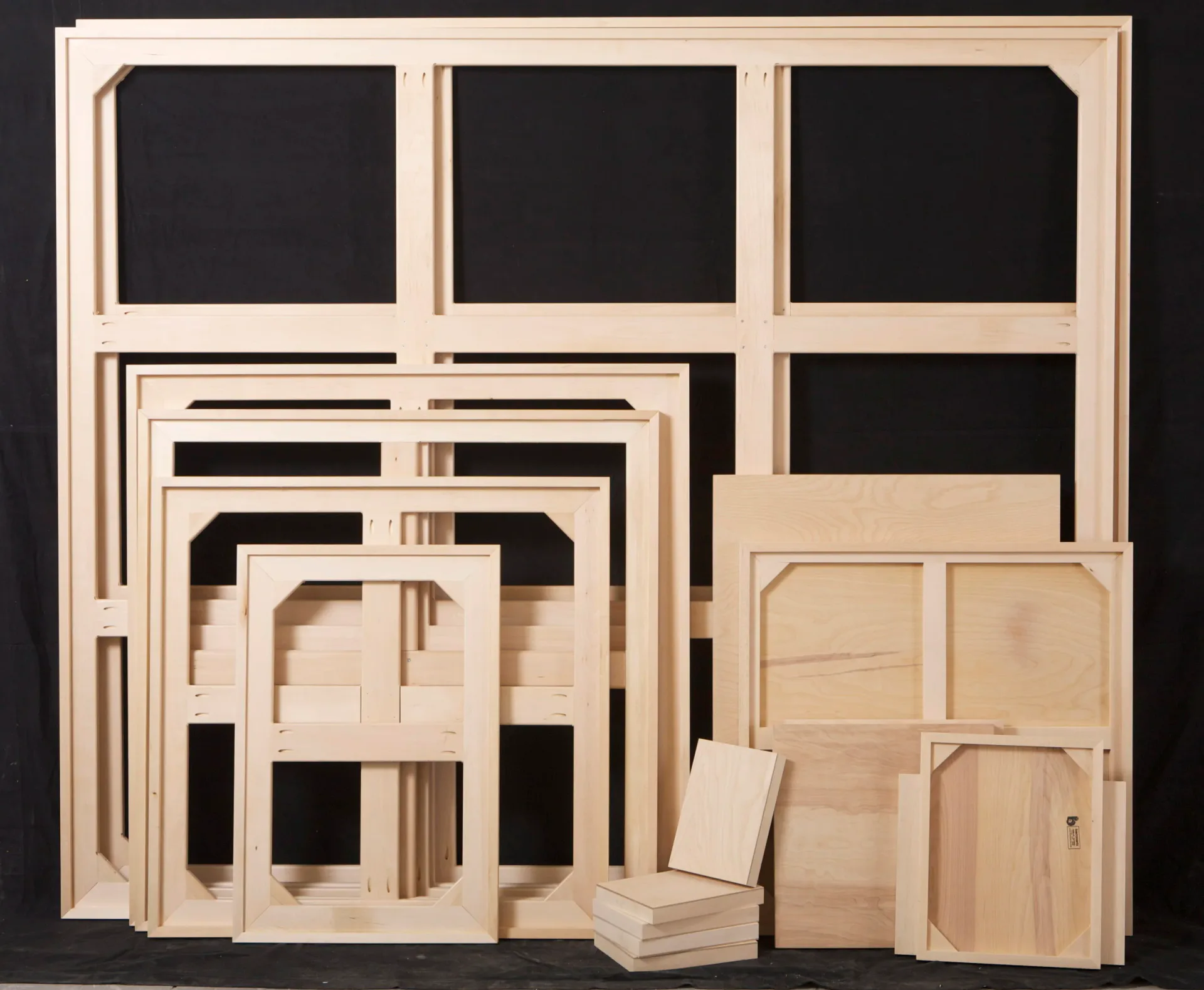 Wooden cabinetry and furniture component designs displaying various door styles and configurations in natural light wood finish by Barronarts.