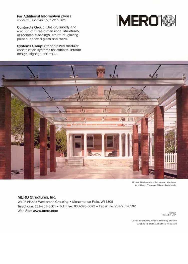 Modern glass-roofed pavilion with red brick columns and clerestory lighting by Bitnar Architects, featuring a minimalist interior and manicured landscape visible through transparent walls.