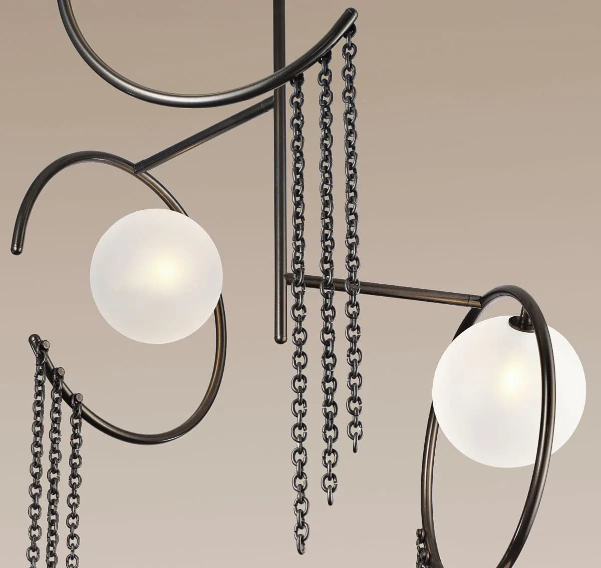 Contemporary chandelier with frosted glass spheres suspended from dark metal framework and chain details, by Blueprint Lighting.