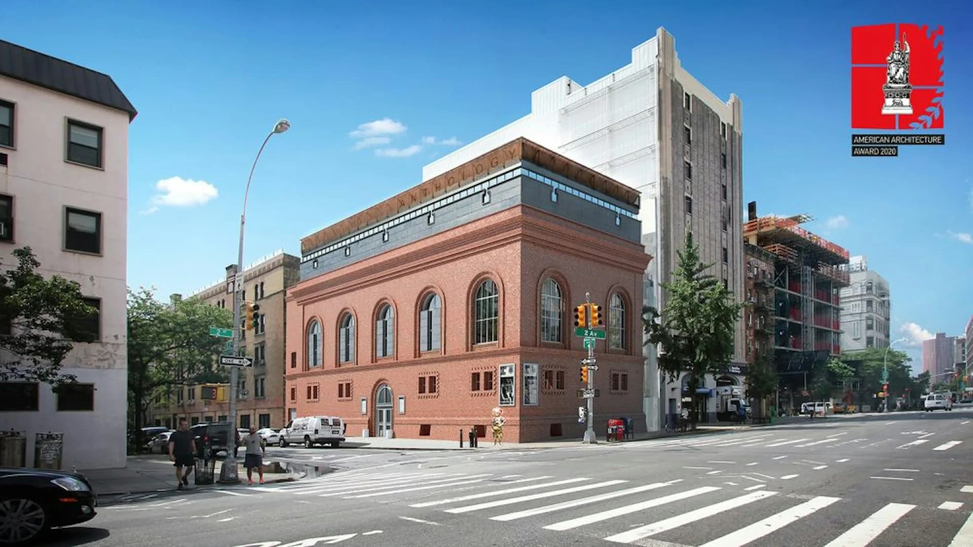 Street-level view of a restored red brick historic building with arched windows, surrounded by modern residential towers on an urban plaza by Bone/Levine Architects.