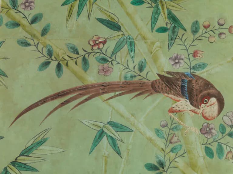 Delicate watercolor illustration of a pheasant perched among flowering branches and foliage on soft green background by Williams Lawrence.