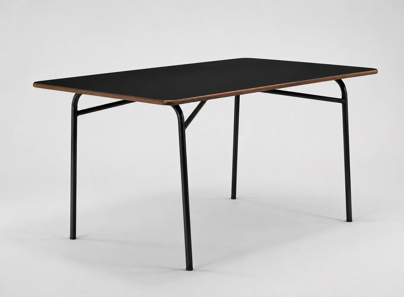 Minimalist folding table with black metal frame and dark top, featuring clean geometric lines and modern industrial design by Demisch Danant.