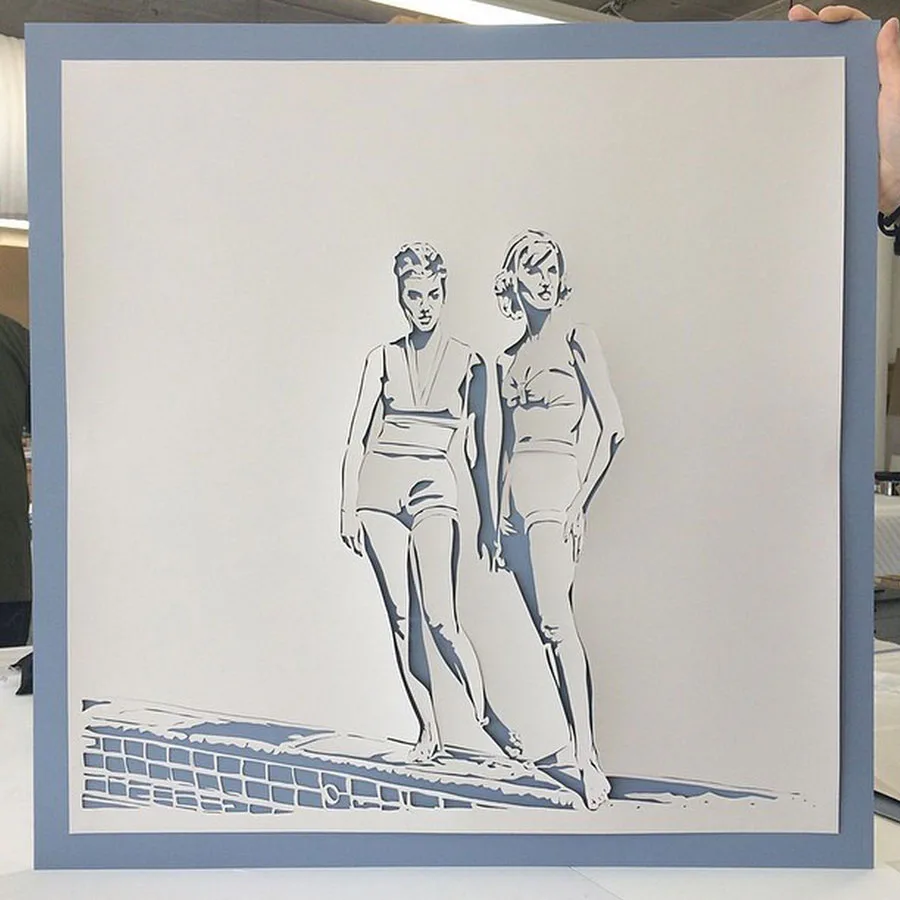 Line drawing of two figures in swimwear standing by a poolside with geometric tile pattern, rendered in ink sketch style by Downing Frames.