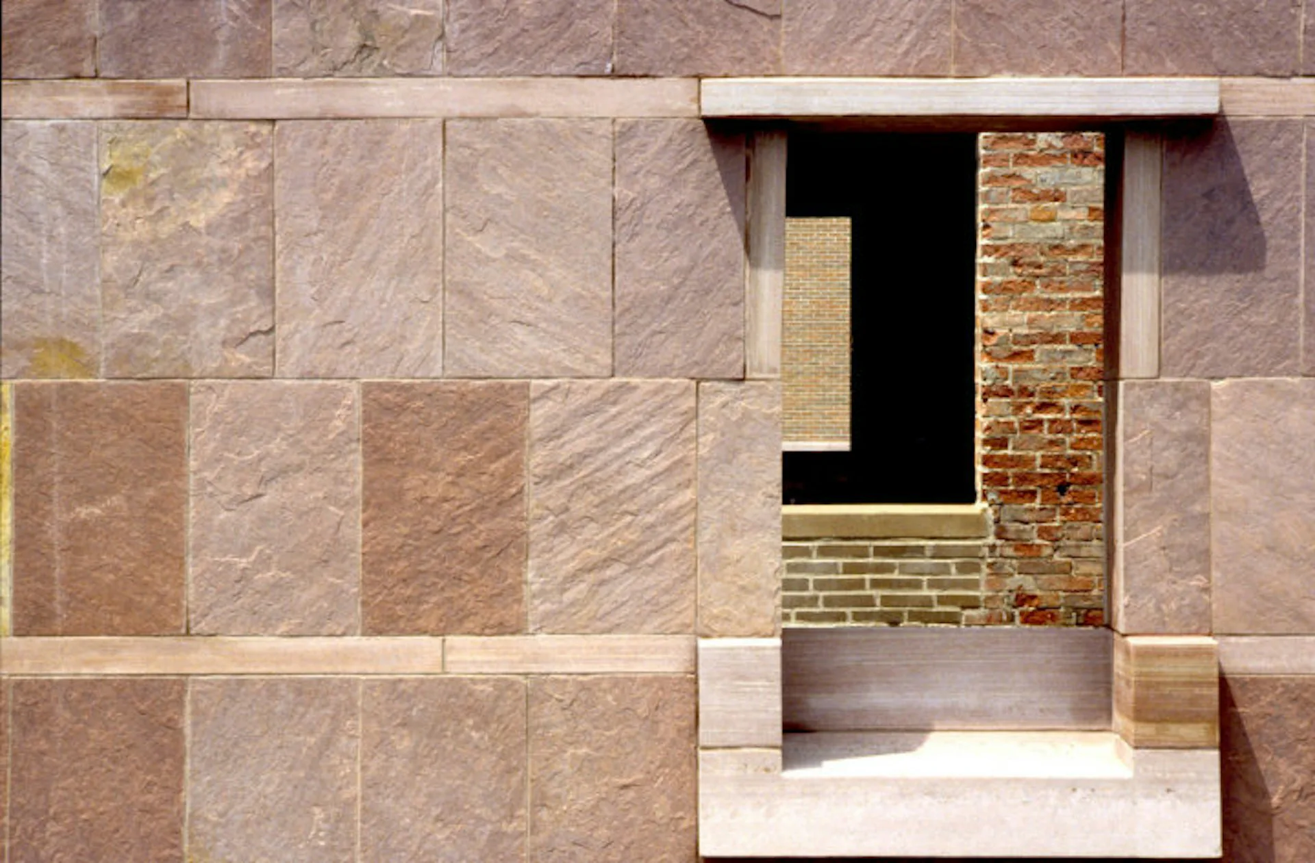 Architectural elevation rendering showing a stone and brick facade with recessed window opening and geometric material composition by Elemental Architecture LLC.