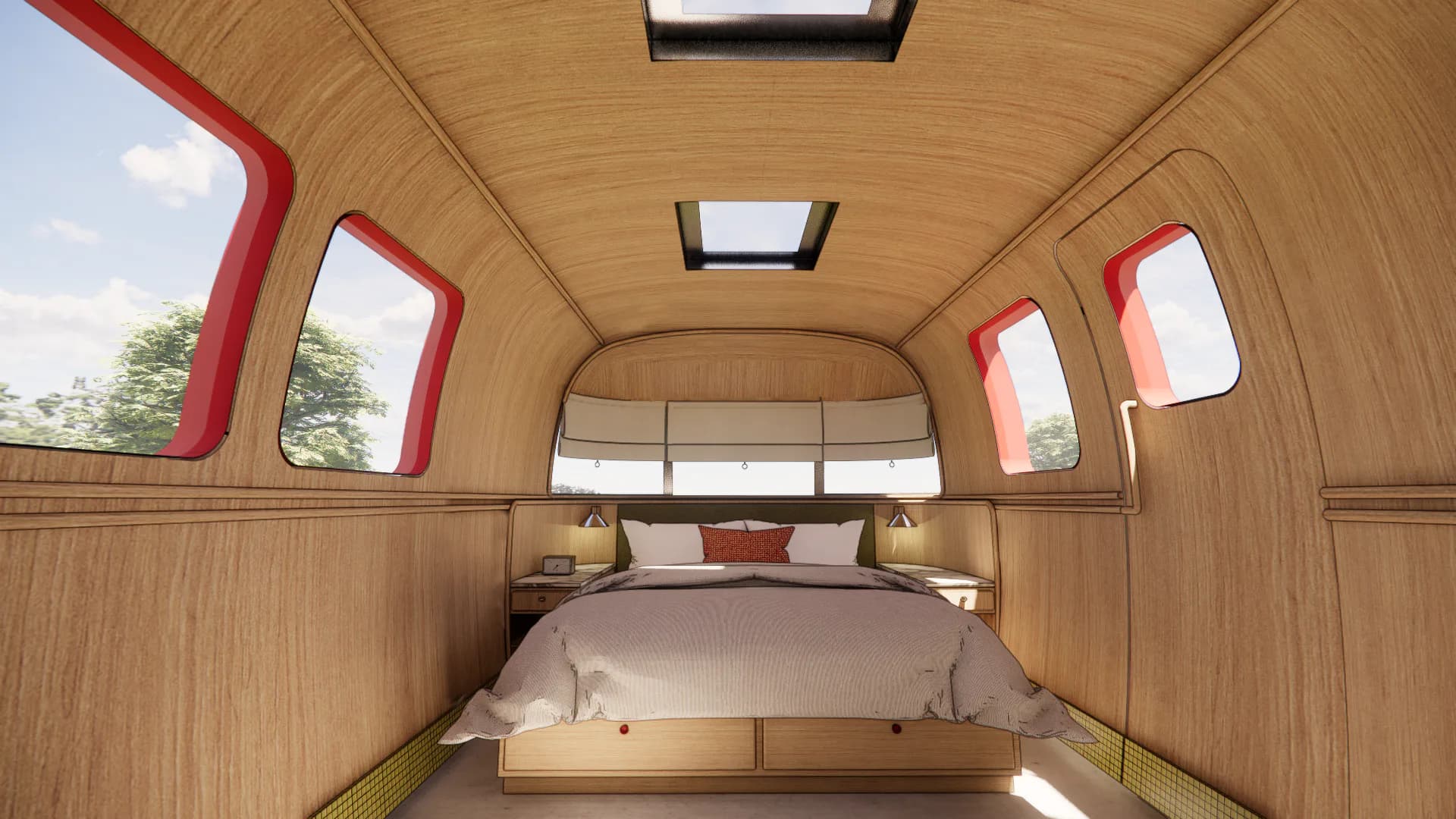 Wooden travel trailer interior with bed, red-trimmed windows, and integrated lighting by Ember Studio.