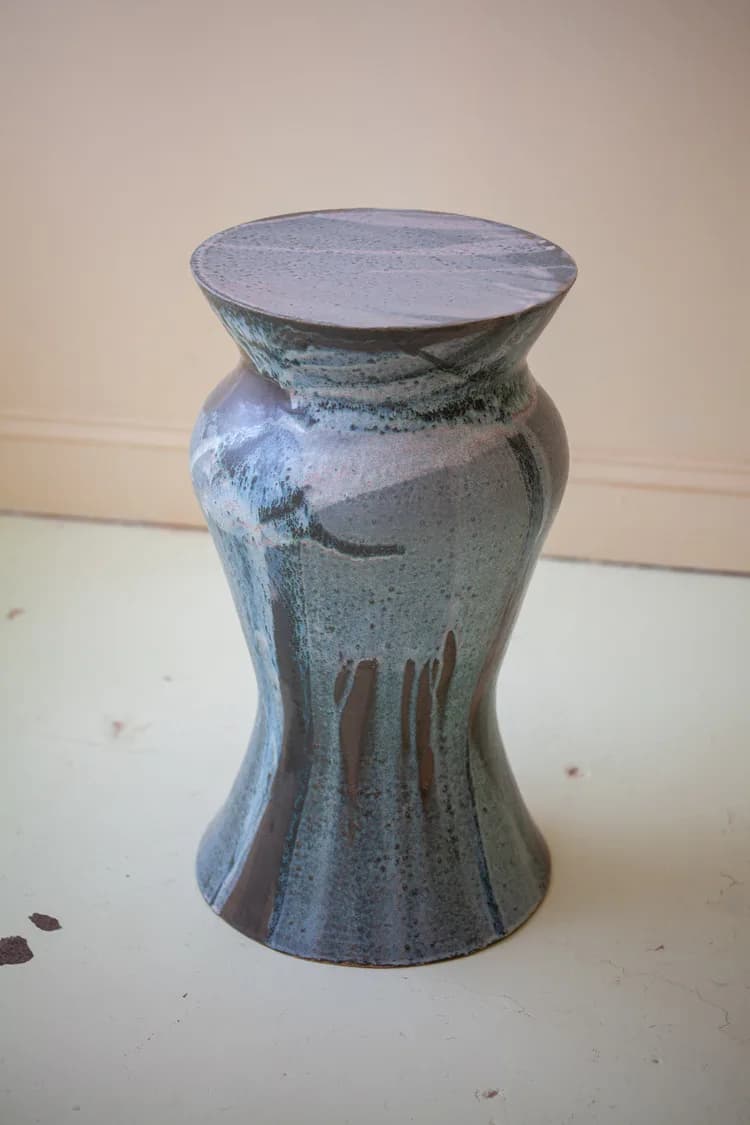Ceramic vessel with tapered hourglass form featuring matte blue-grey glaze and organic surface texture by Episode.