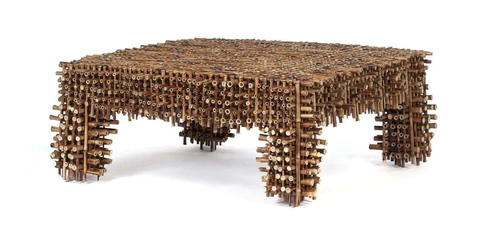 Sculptural cork table with cylindrical stacked elements forming an organic, textured surface with draped undulating edges, by Estudio Campana.