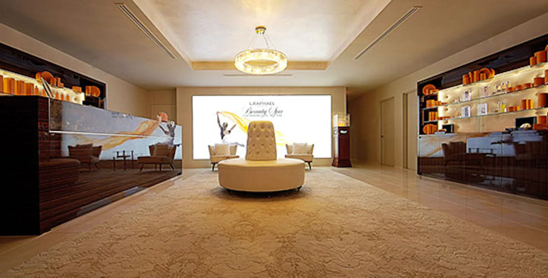 Luxurious modern showroom with curved golden seating element, warm ambient lighting, display shelving, and polished flooring by FZAD.