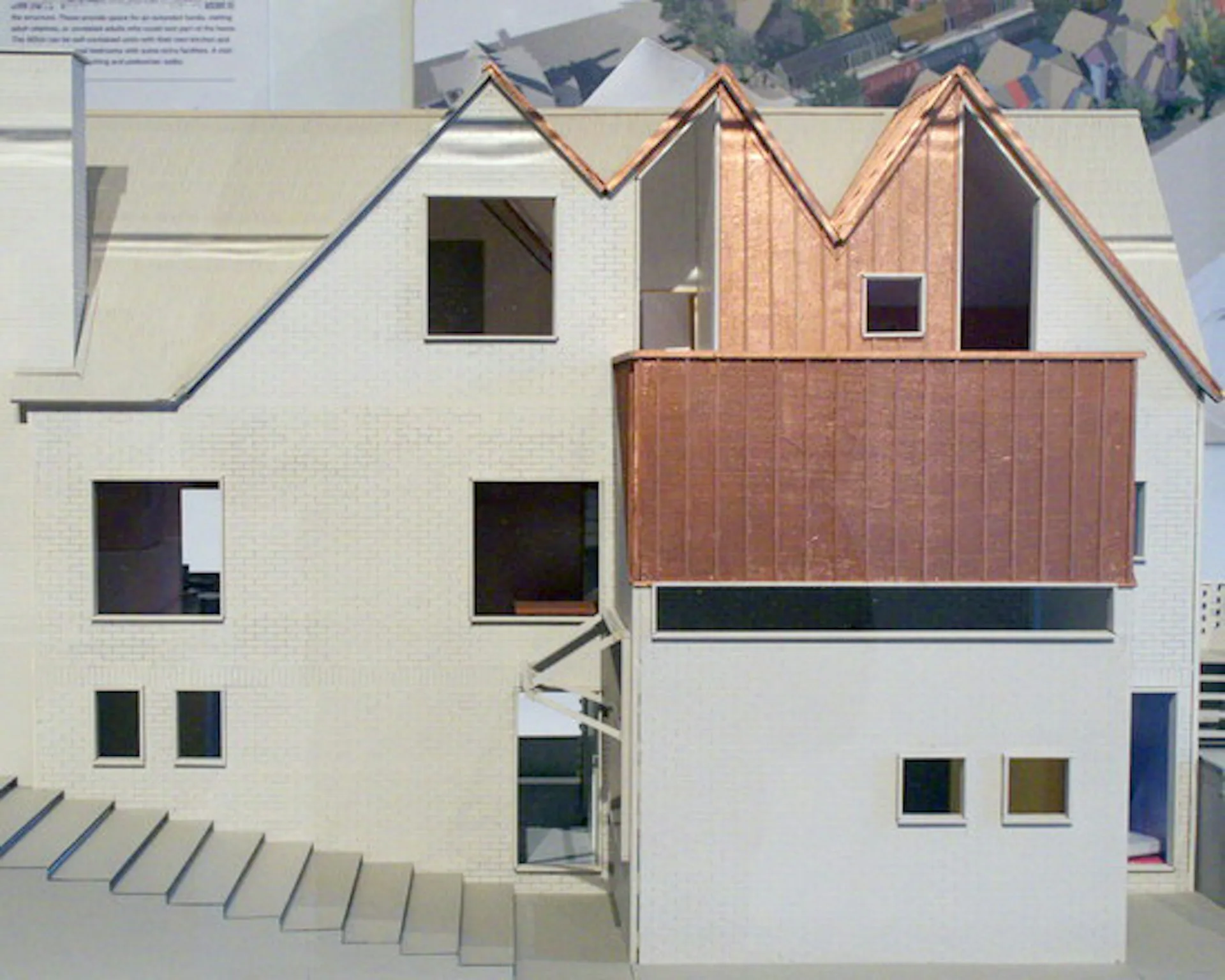 Architectural elevation of a contemporary residential building with white brick facade, copper/bronze roof forms, and stacked window arrangements by Gans studio.