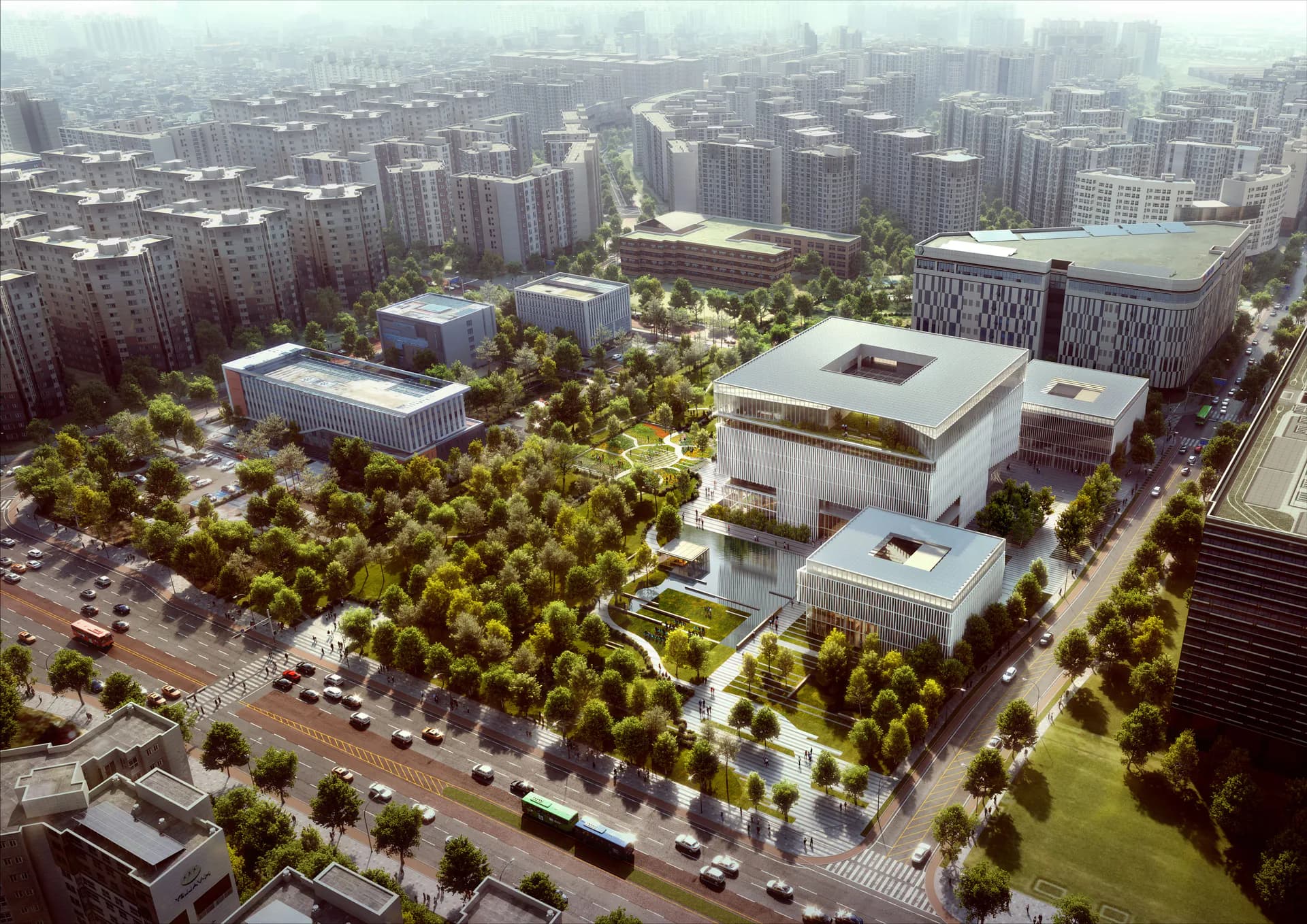 Aerial view of a mixed-use urban development with modern white buildings, extensive tree canopy, and integrated public spaces by H ARCHITECTURE.