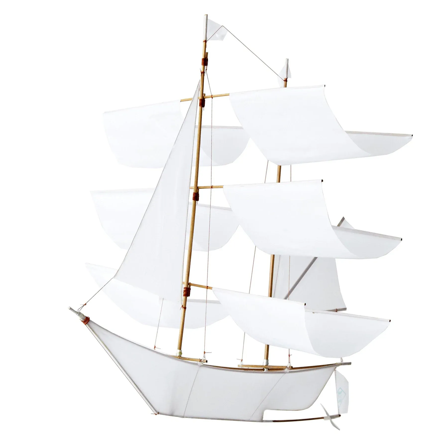 White sailing ship model with brass mast and rigging details against neutral background, by Haptic Lab.