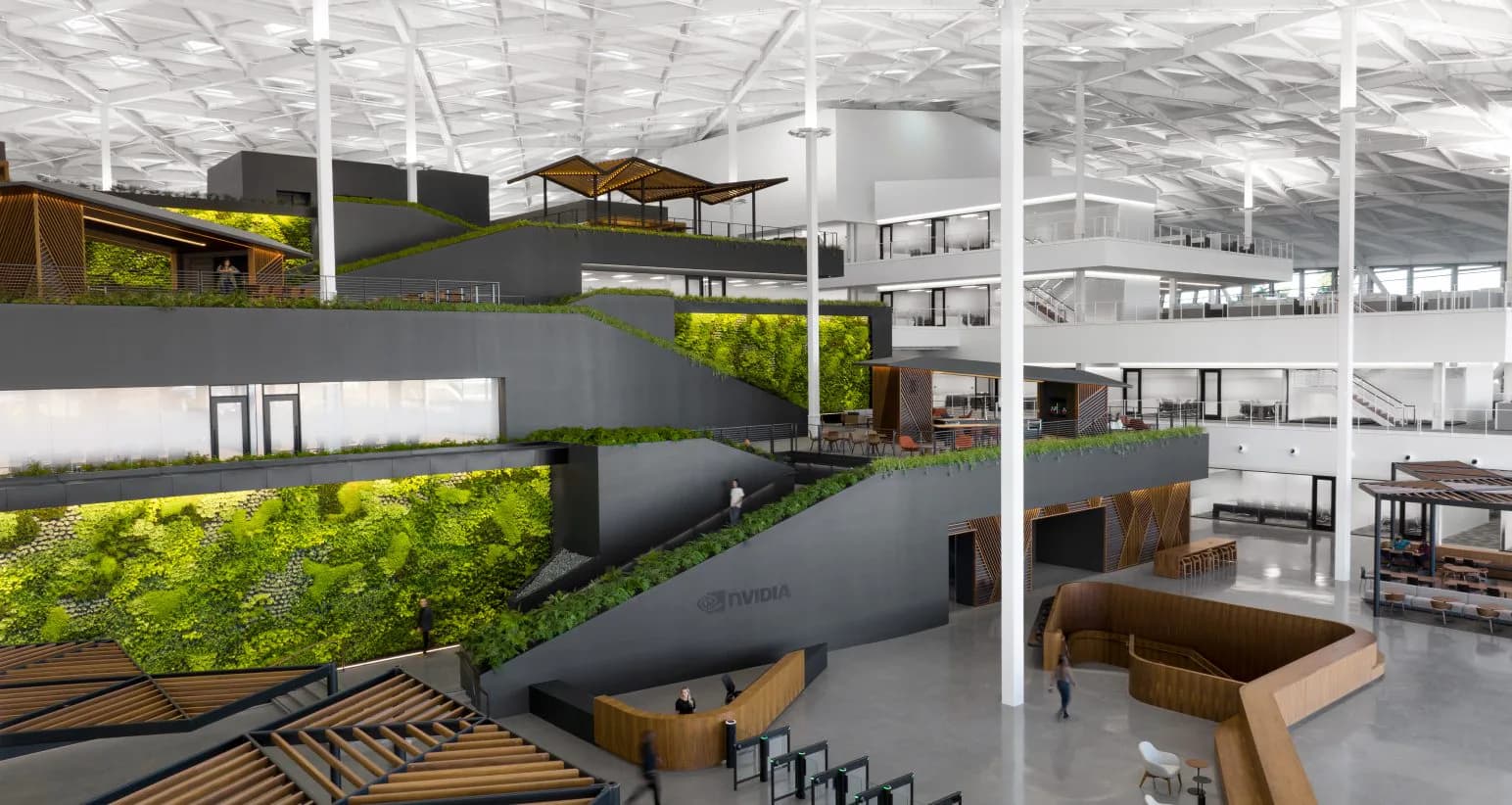 Modern industrial loft space with living green walls, multi-level mezzanines, wooden accents, and contemporary furniture bathed in natural skylight, designed by HLB Lighting Design.