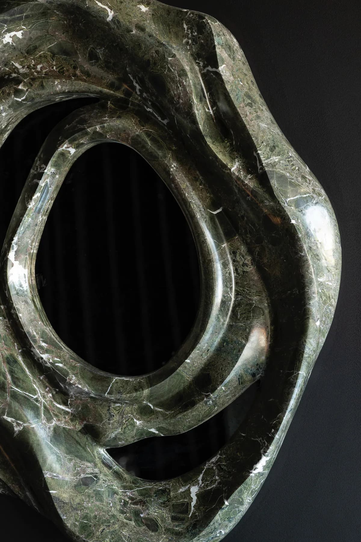 Stone sculpture with organic oval aperture and curved abstract forms, carved in pale green marble by HOMA.