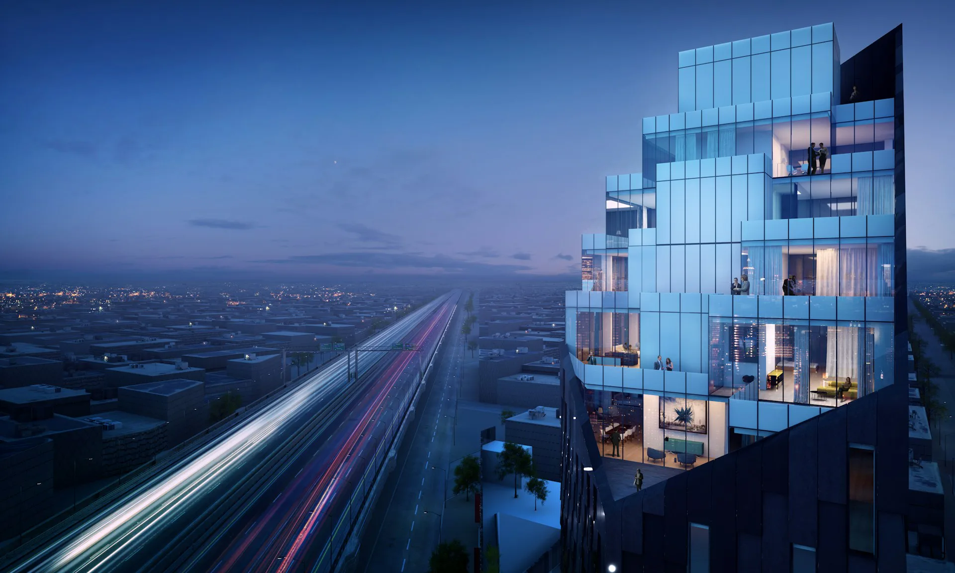 Twilight cityscape with illuminated glass-facade residential tower overlooking a highway with light trails, by HWKN Architecture.
