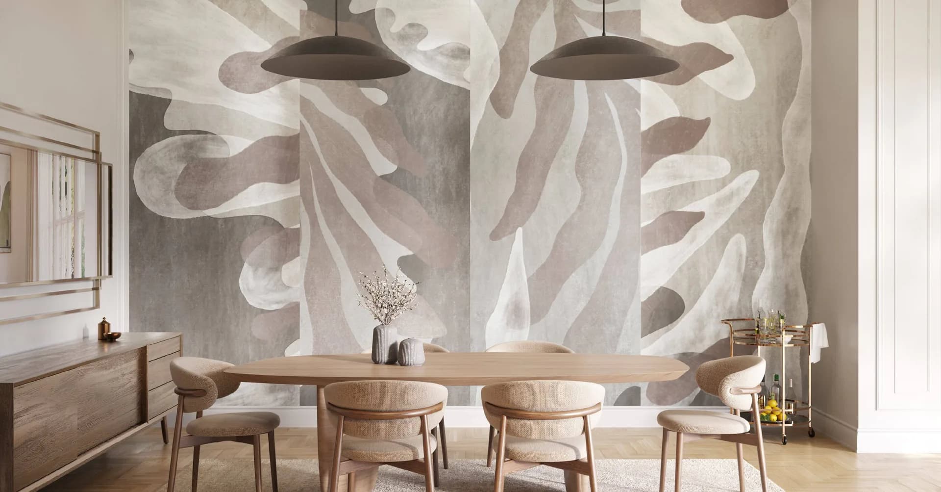 Modern dining room with natural wood chairs and table, featuring a striking abstract wall mural in neutral tones with organic shapes and pendant lighting by Innovations in Wallcoverings.