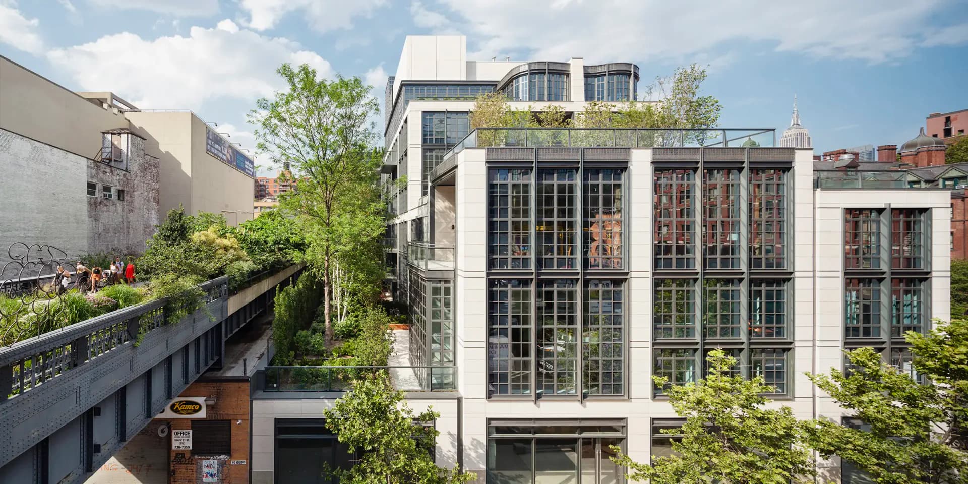 Modern mixed-use building with glass and metal facade, green rooftop terrace, and integrated landscaping in urban setting by Kohn Pedersen Fox.