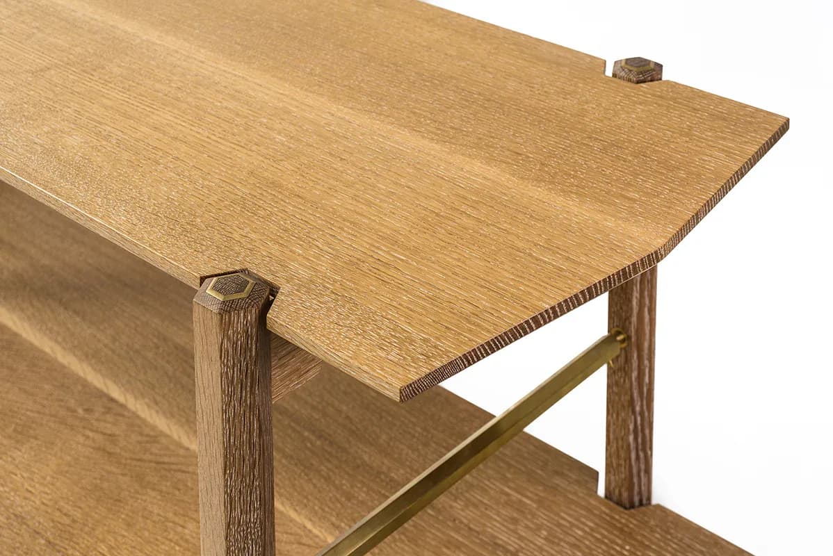 Light oak desk with angled cross-bracing and shelf detail, showcasing joinery and wood grain in a minimalist design by KWH Furniture.