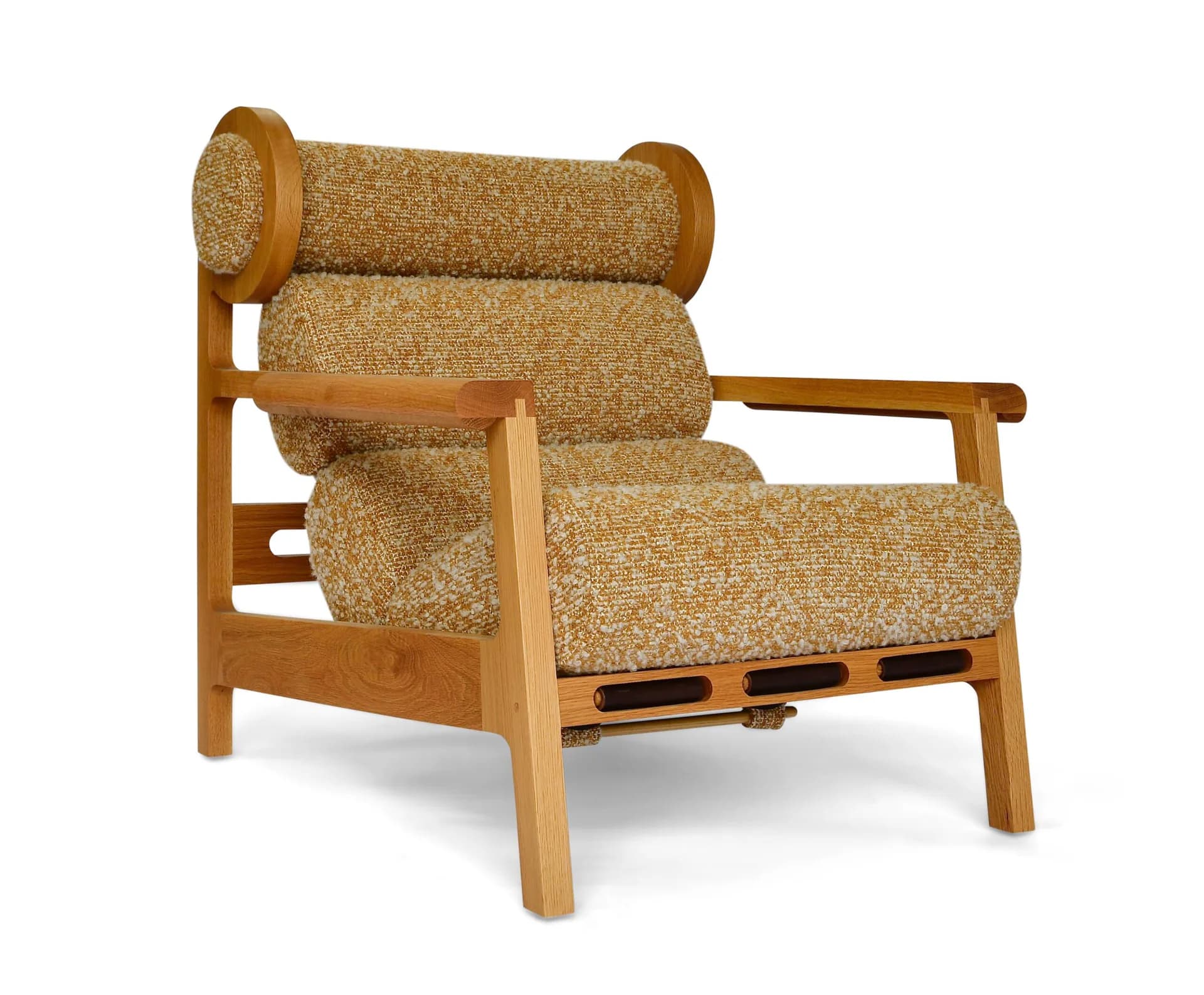 Wooden armchair with tan upholstered cushions and cylindrical bolster pillows, featuring clean-lined wooden frame and arms by Last Ditch Design.