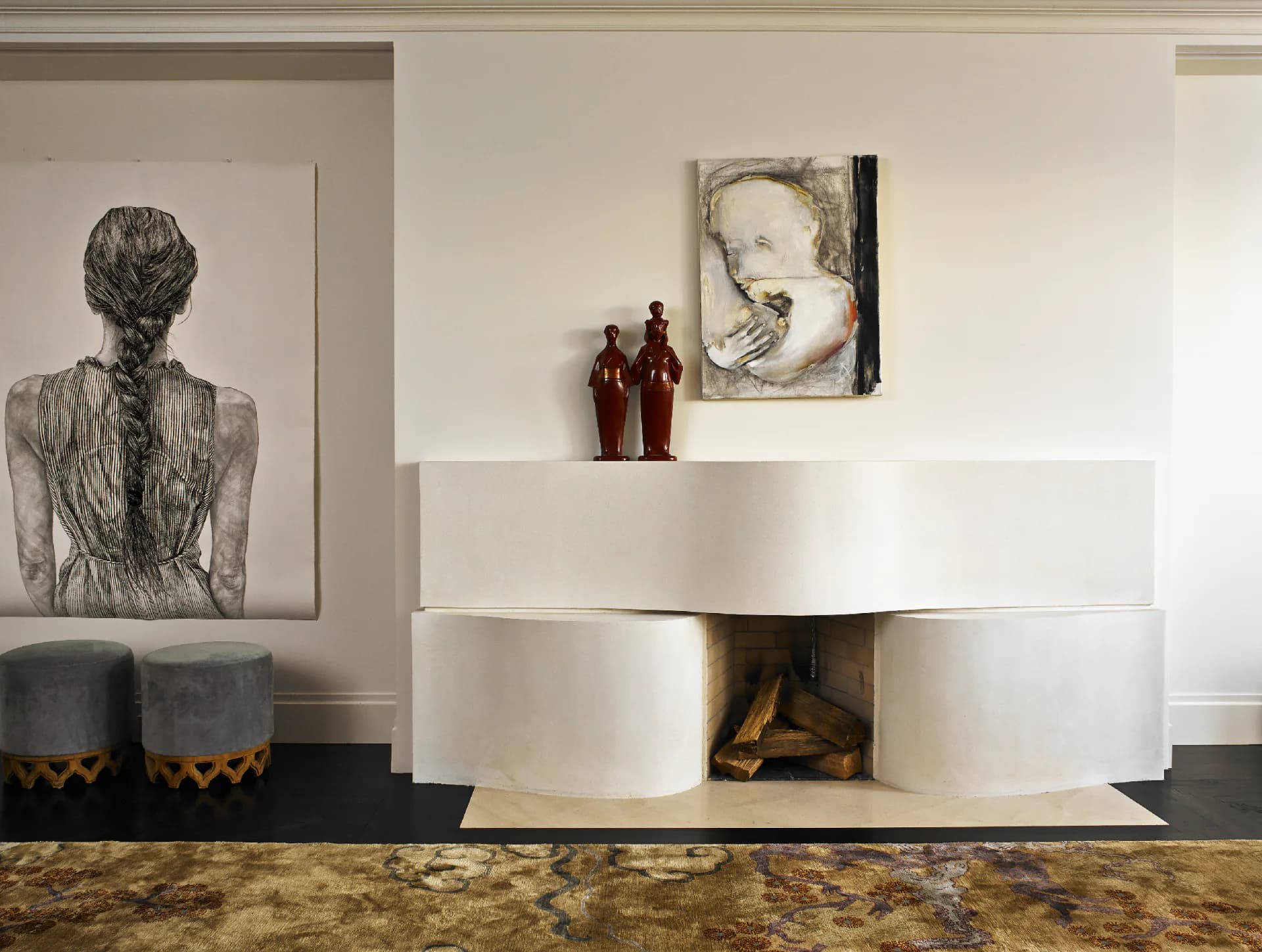 Contemporary living space featuring a sculptural white curved credenza with open shelving, paired with framed artwork and decorative objects, designed by Leyden Lewis Design Studio.
