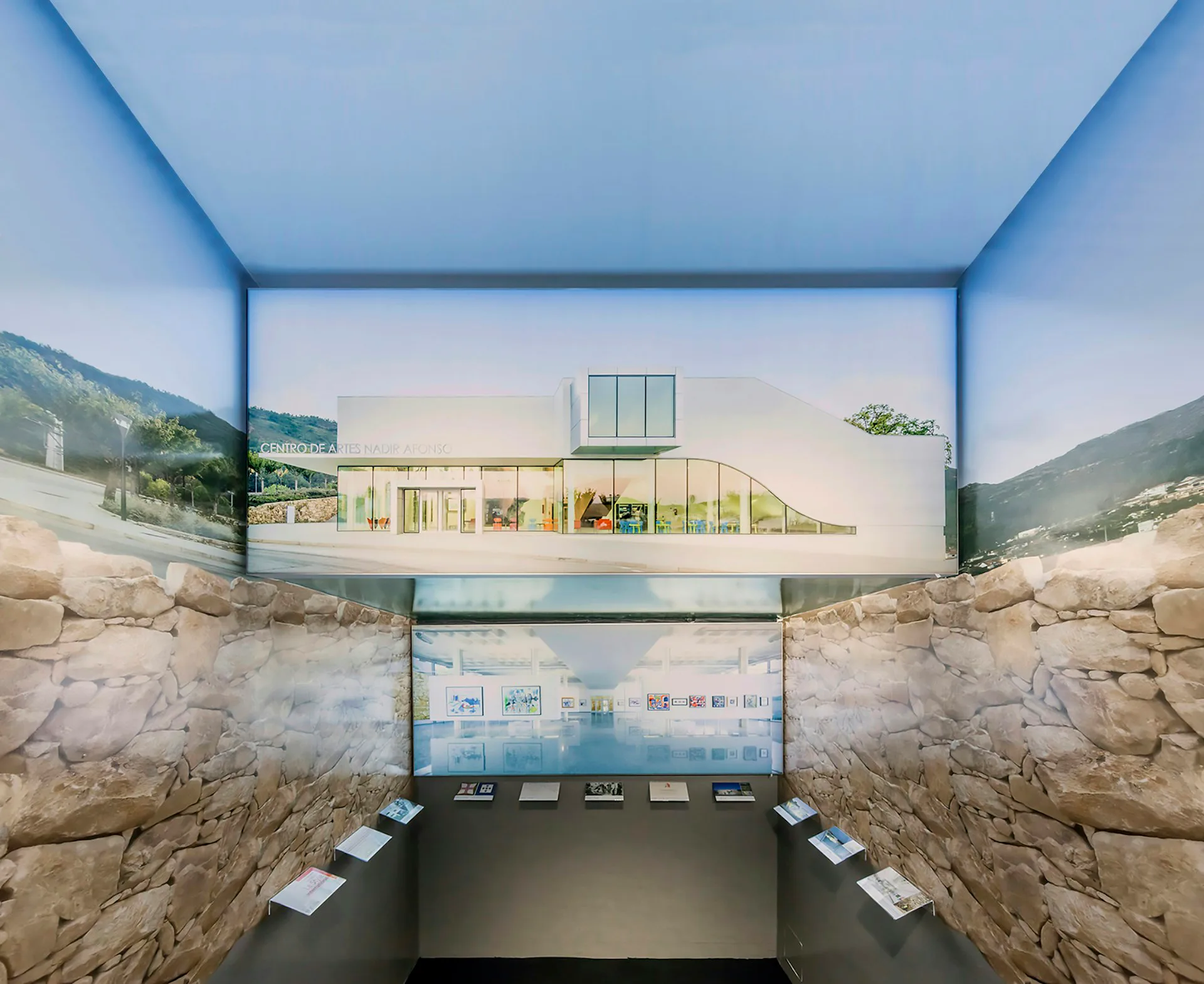 Architectural section rendering showing an underground museum gallery with stratified rock walls, skylit upper level displaying a modernist house model, and lower exhibition space with display cases, by Louise Braverman Architect.