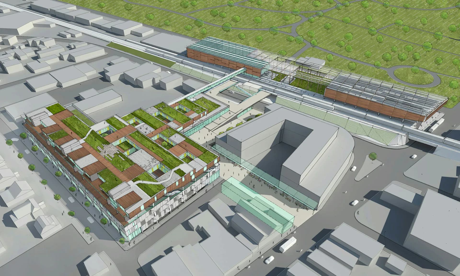 Aerial perspective rendering of a mixed-use development with residential buildings, green roofs, and civic spaces adjacent to transit infrastructure by LTL Architects.