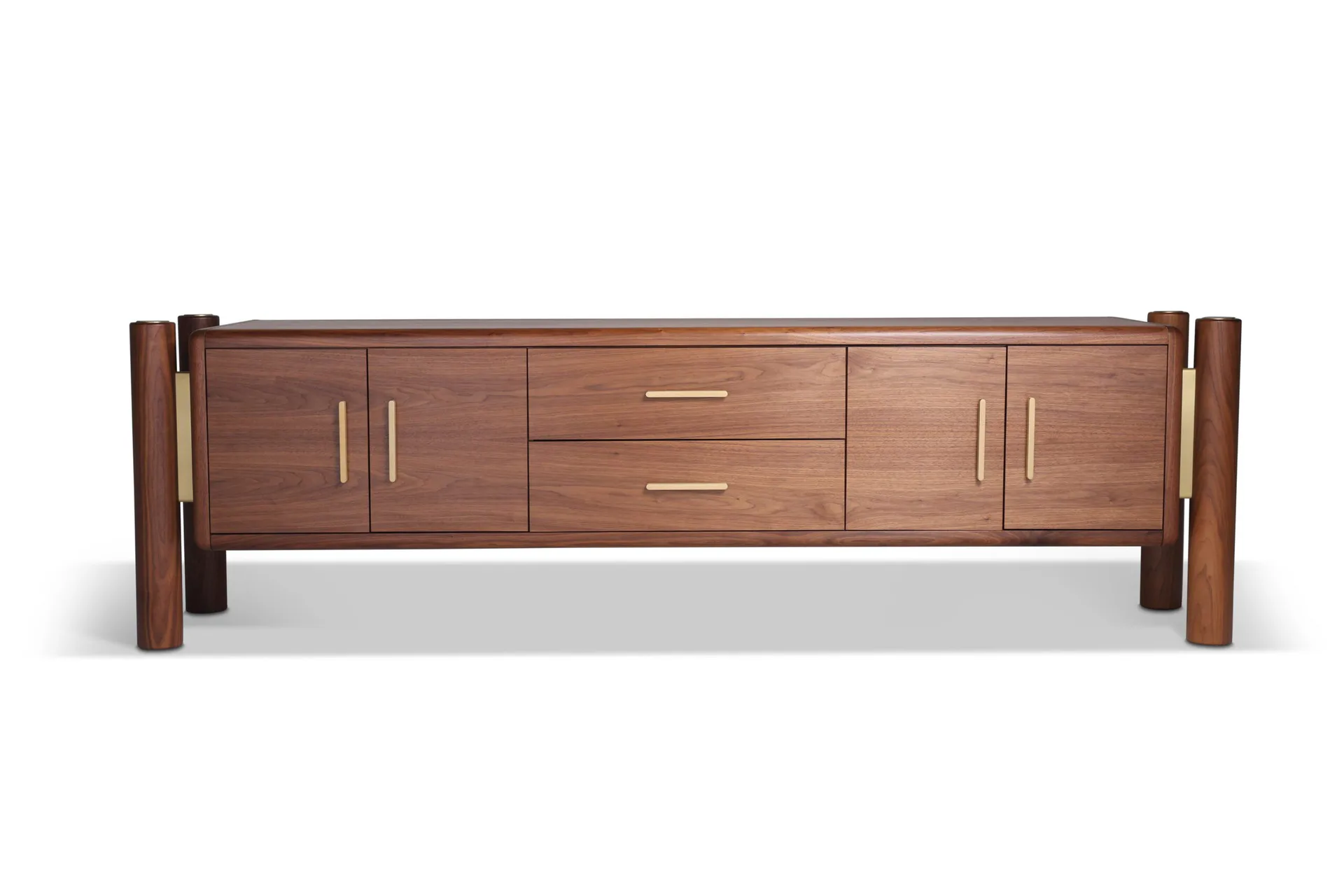 Walnut credenza with brass hardware and vertical post legs, featuring cabinet doors and centered drawers, by Mark Jupiter.
