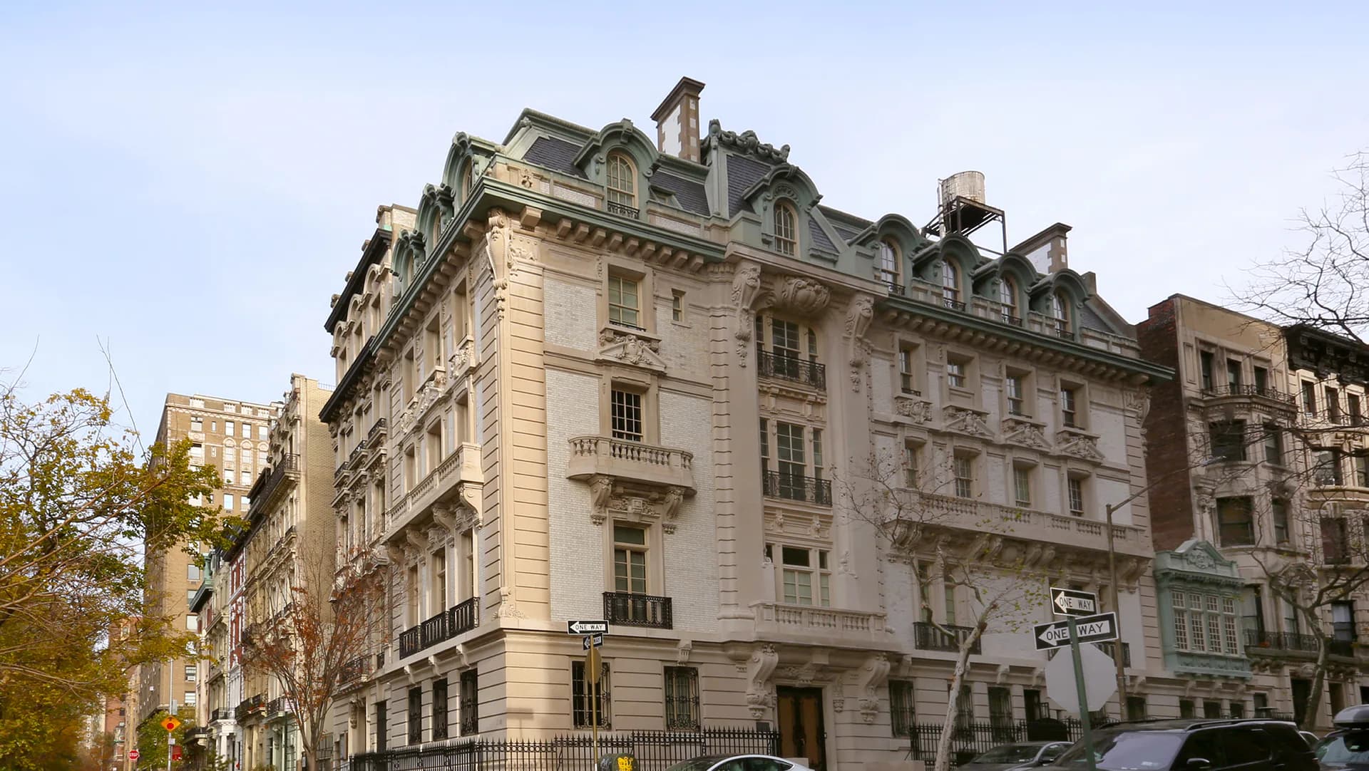 Elegant Parisian-style stone facade with mansard roofs and ornate architectural detailing, showcasing classical design by MERGAL ARCHITECTURE & DESIGN.