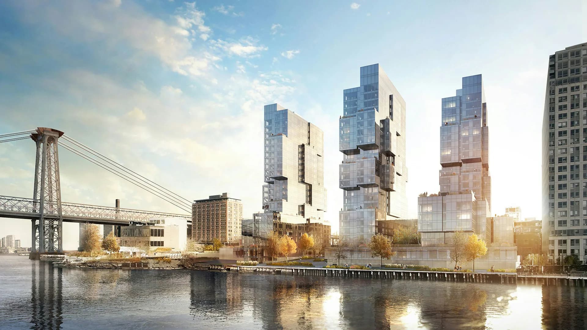 Waterfront residential towers with stacked modular forms in glass and metal, reflected in calm water with bridge visible, by ODA.