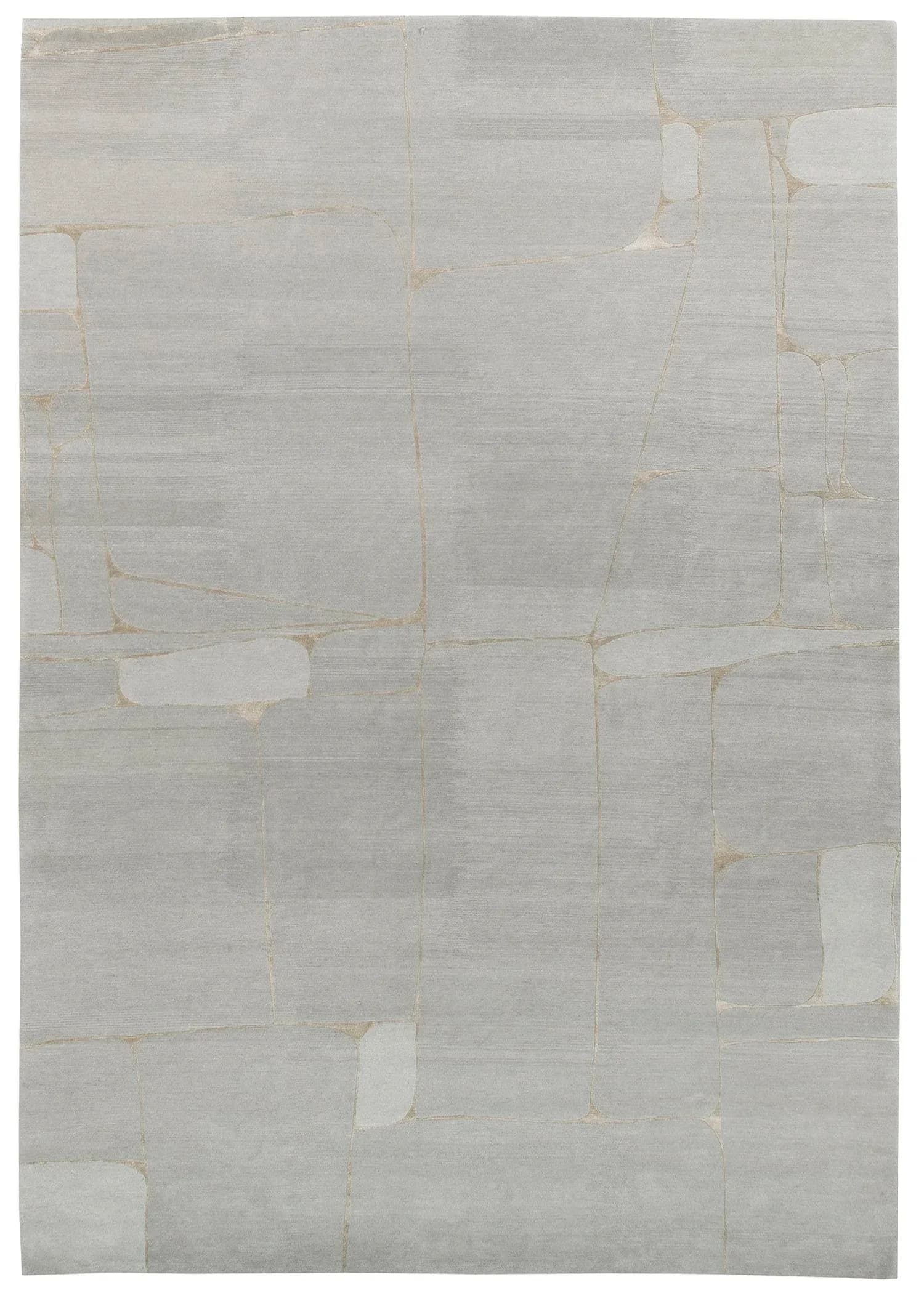Minimalist cream and beige carpet with geometric grid pattern and subtle white rectangular inlays, creating an abstract composition by Odegard Carpets.