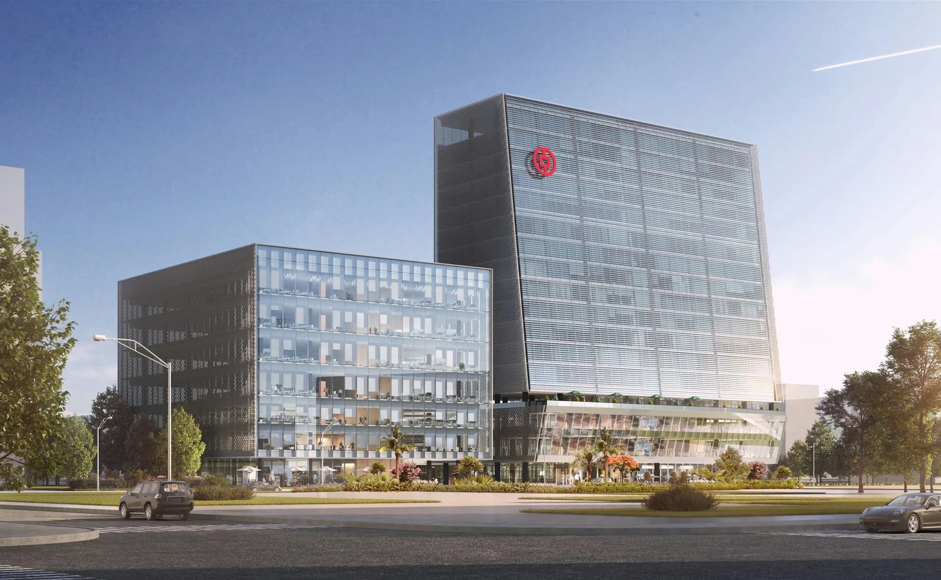 Modern mixed-use architectural complex featuring glass-clad towers with integrated retail and green spaces along a tree-lined boulevard by PEI Architects.