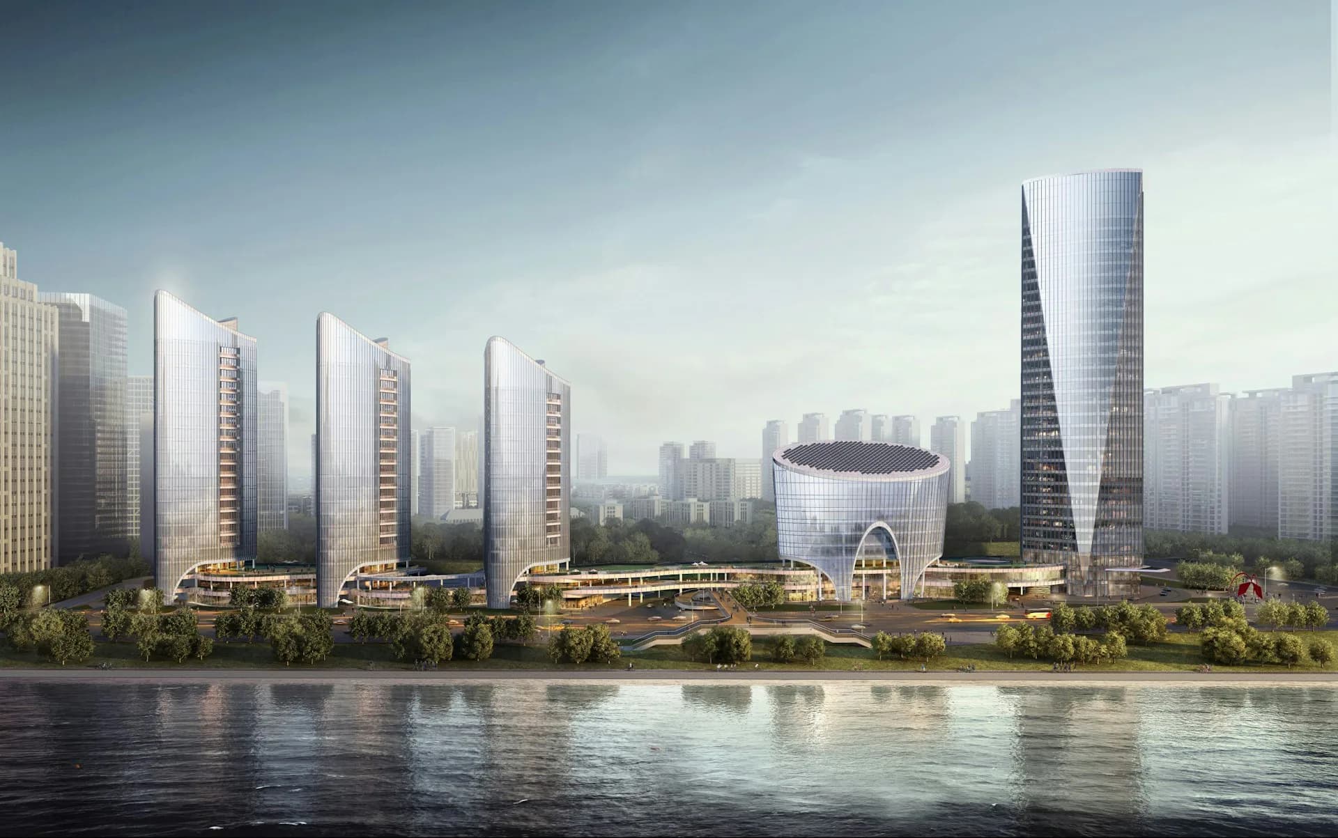 Waterfront development with residential towers, curved architectural forms, and central rotunda overlooking river by PEI Architects.