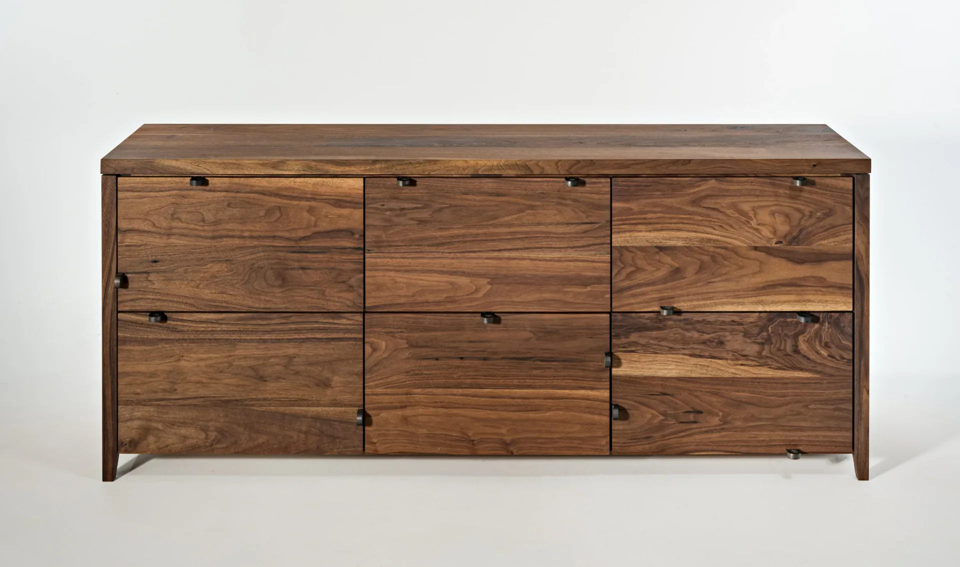 Walnut wood dresser with nine drawers arranged in three columns, featuring dark metal hardware and tapered legs, by Phaedo Design.