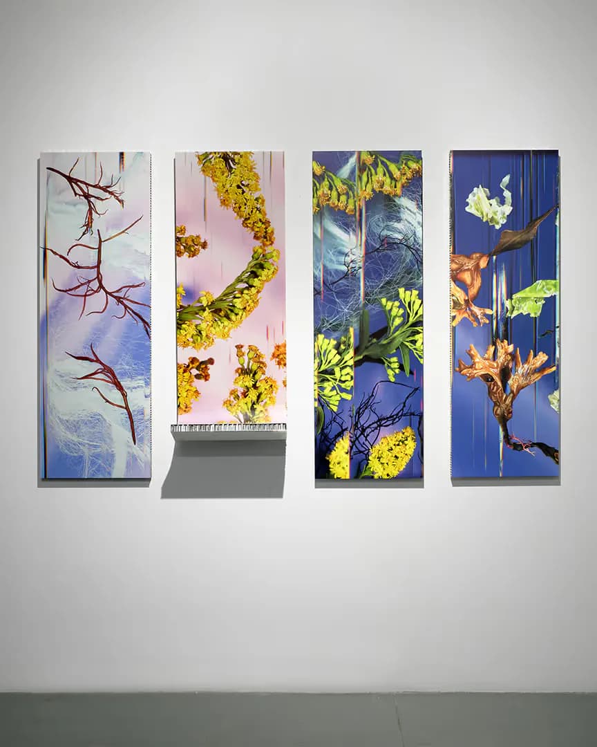 Four tall vertical panels with botanical and nature illustrations featuring yellow flowers, branches, and blue backgrounds displayed as an installation by Powerhouse Arts.