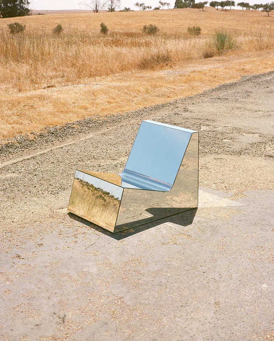 Sculptural outdoor installation featuring mirrored and reflective surfaces in a rural landscape setting by Project 213A.