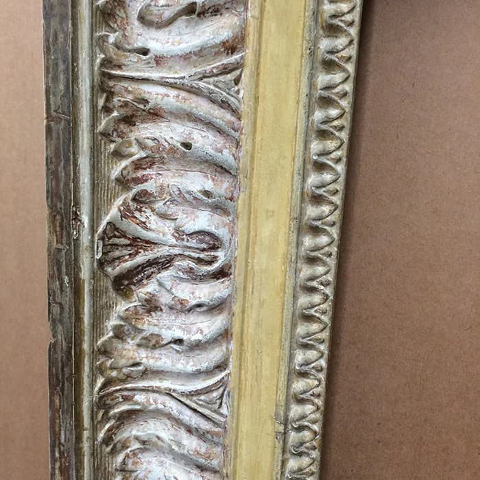 Ornate gilded frame molding detail with carved scrollwork and patinated gold leaf finish by Rhonda Feinman Custom Frames, Inc.
