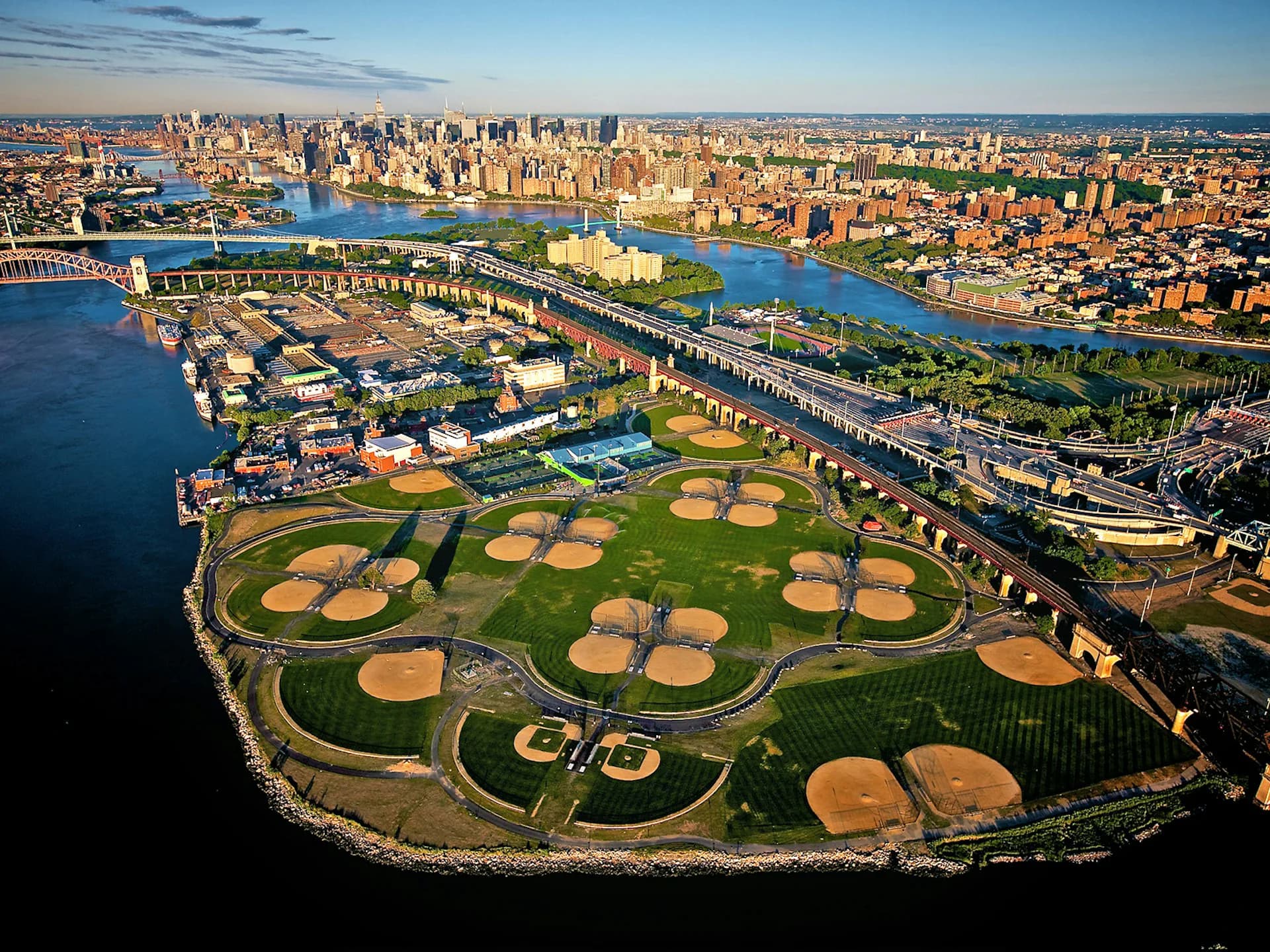 Aerial site plan of Randall's Island sports complex showing multiple baseball fields and athletic facilities designed by Ricardo Zurita Architecture and Planning, P.C. (RZAPS).