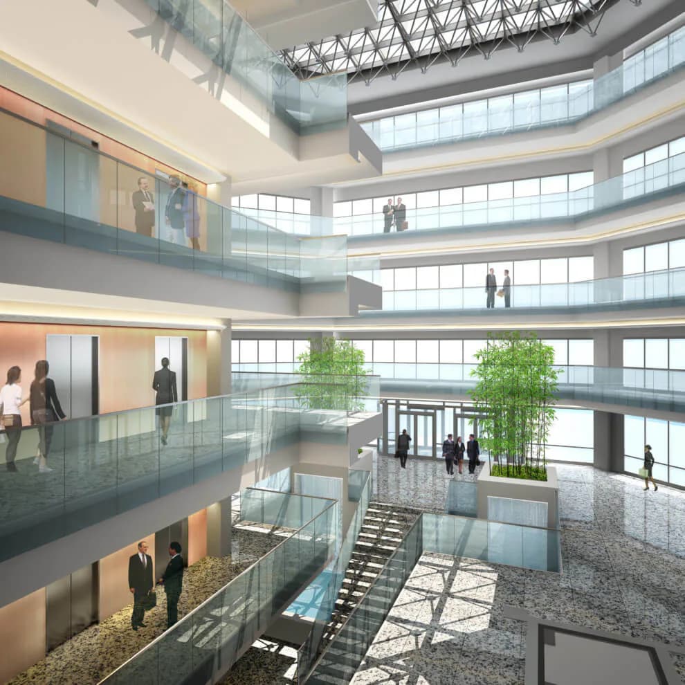 Multi-story atrium with curved glass facades, green plantings, and synthetic figures positioned throughout levels, designed by Richard McElhiney Architects LLC.