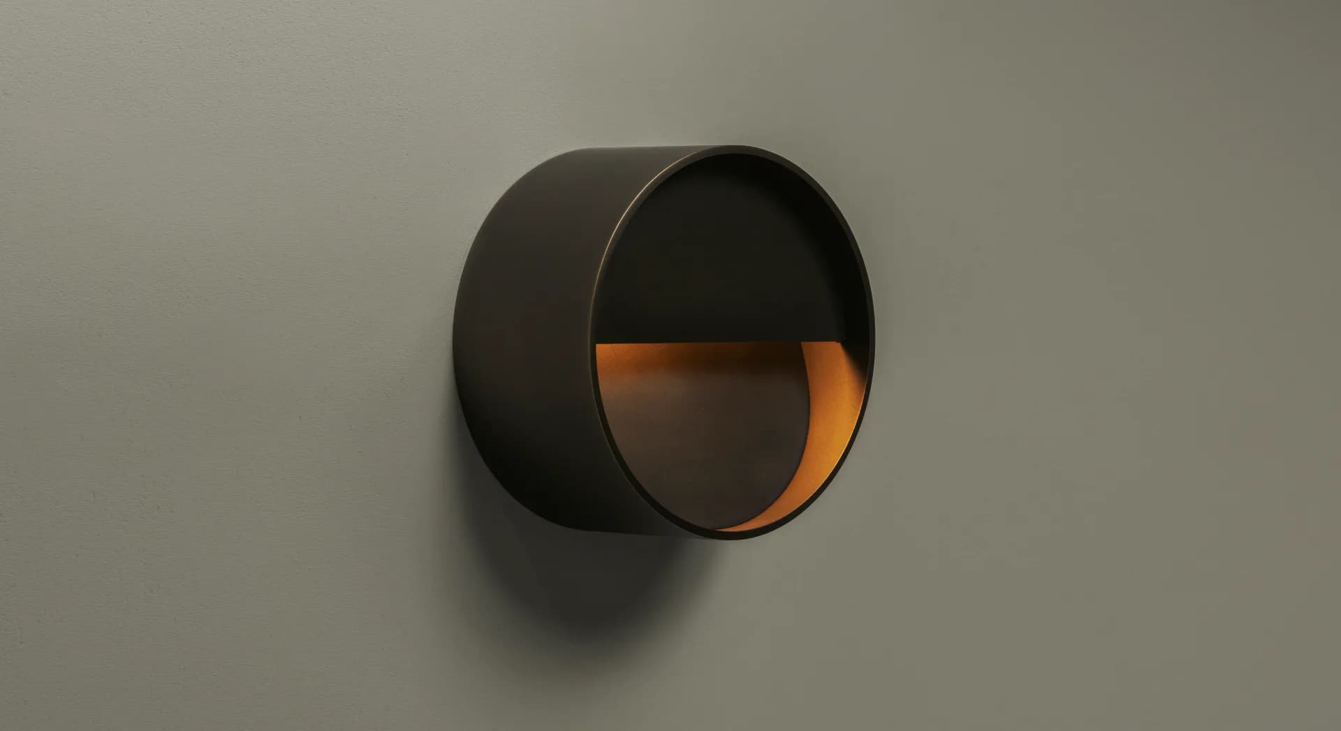 Abstract 3D rendering of overlapping dark gray and orange metallic spheres with dramatic shadows against a neutral background by Roll & Hill.