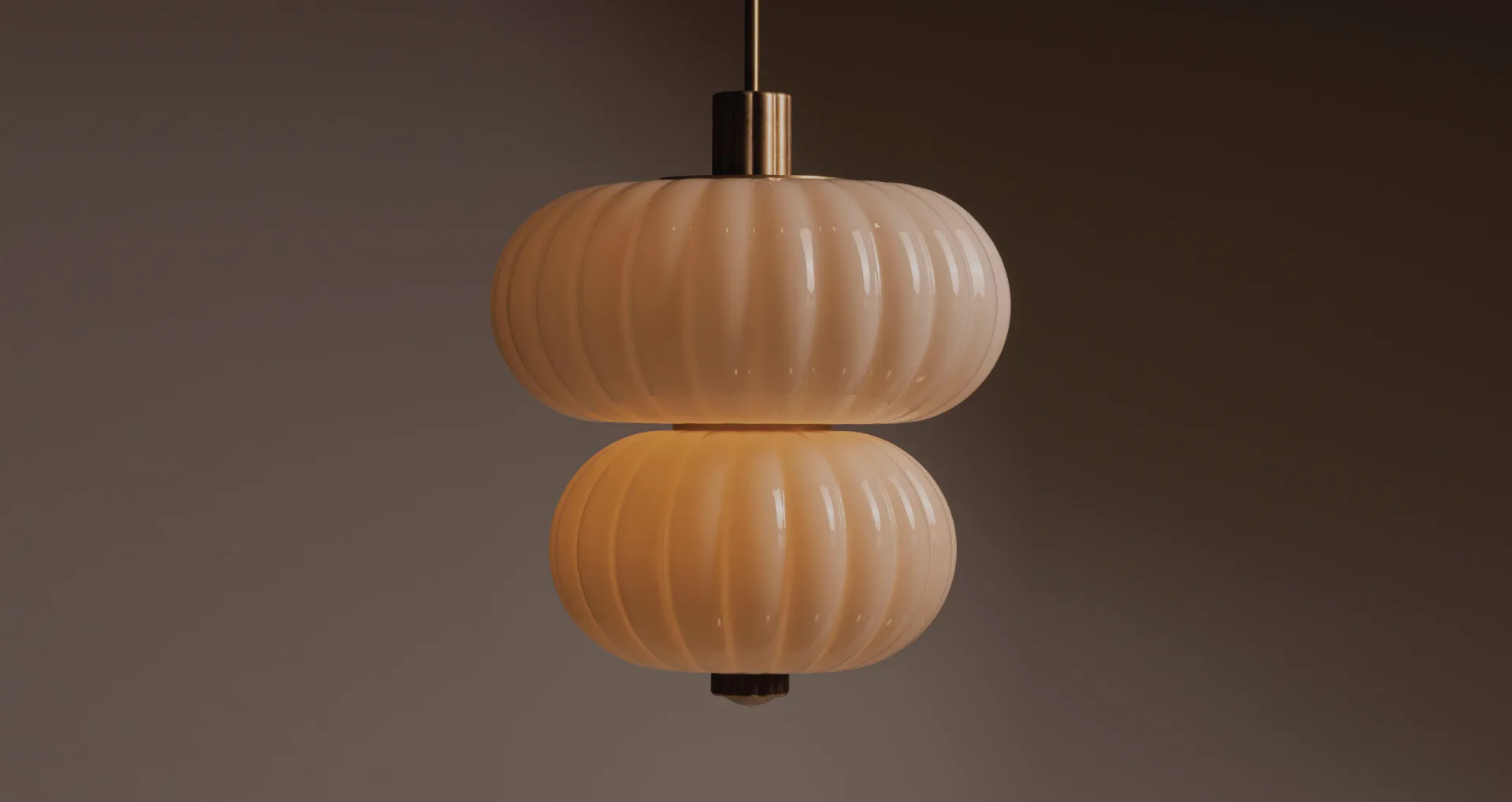 Two stacked ribbed pendant lights with warm wood finish and brass hardware suspended against a neutral background by Roll & Hill.