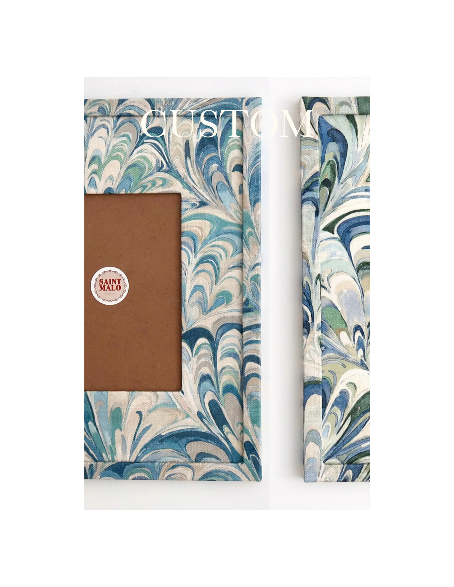 Marbled paper gift packaging with blue and teal swirling patterns and brown kraft panel detail by Saint Malo Designs.