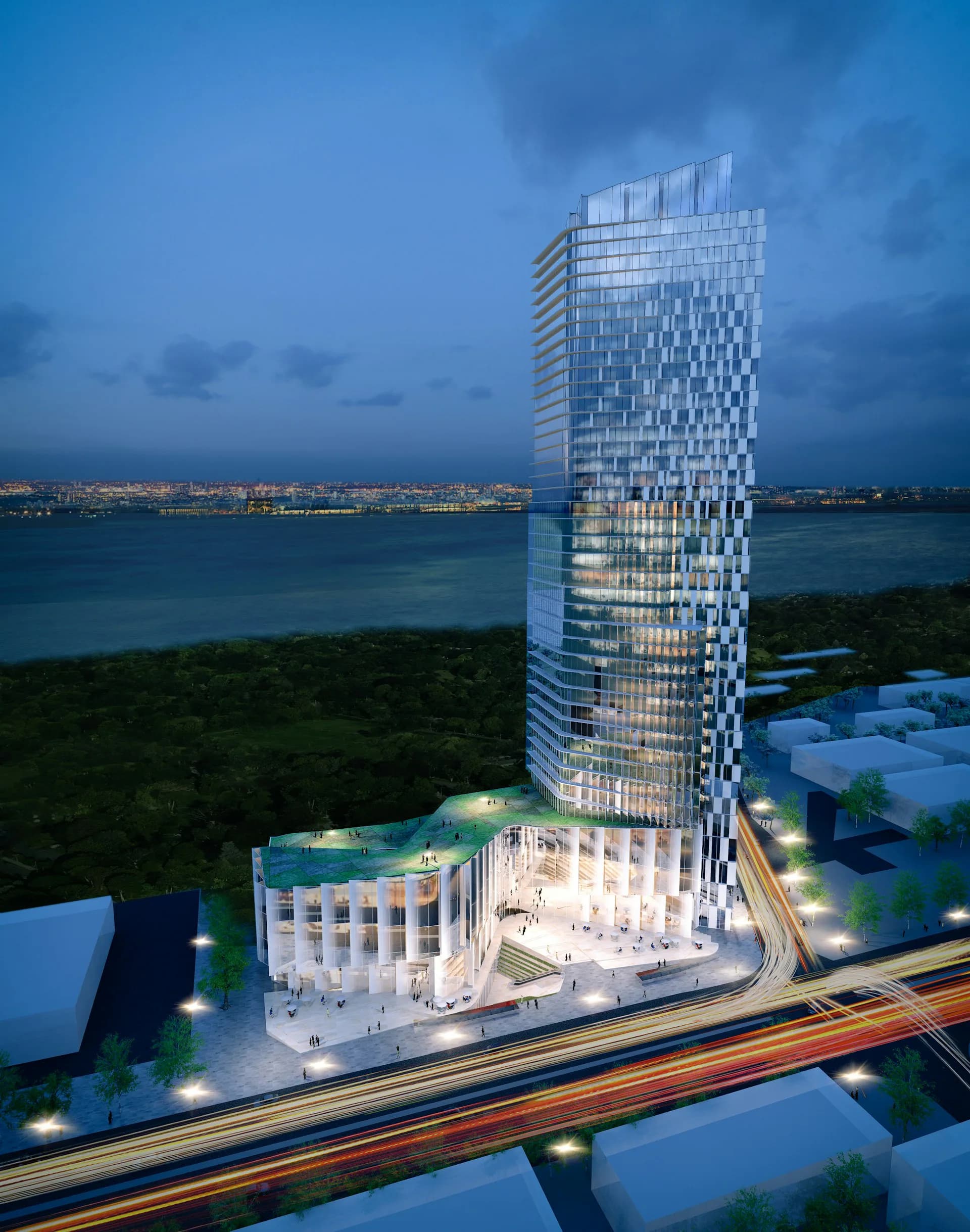 Twilight rendering of a modern waterfront tower with illuminated glass façade beside a curved classical base structure, overlooking a bay landscape by STRATA ARCHITECTS PLLC.