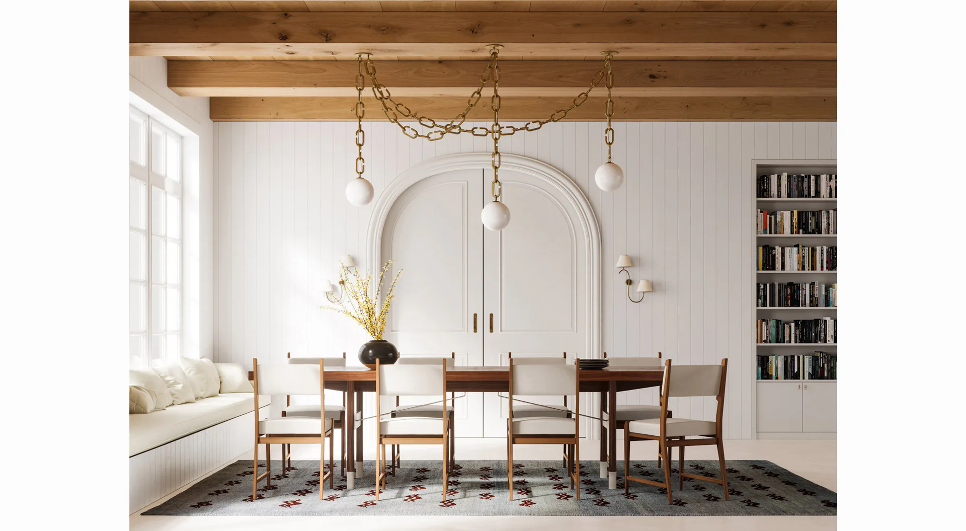Modern dining room with wooden beams, arched mirror, upholstered chairs, pendant lighting, and built-in bookshelves by Trueing.