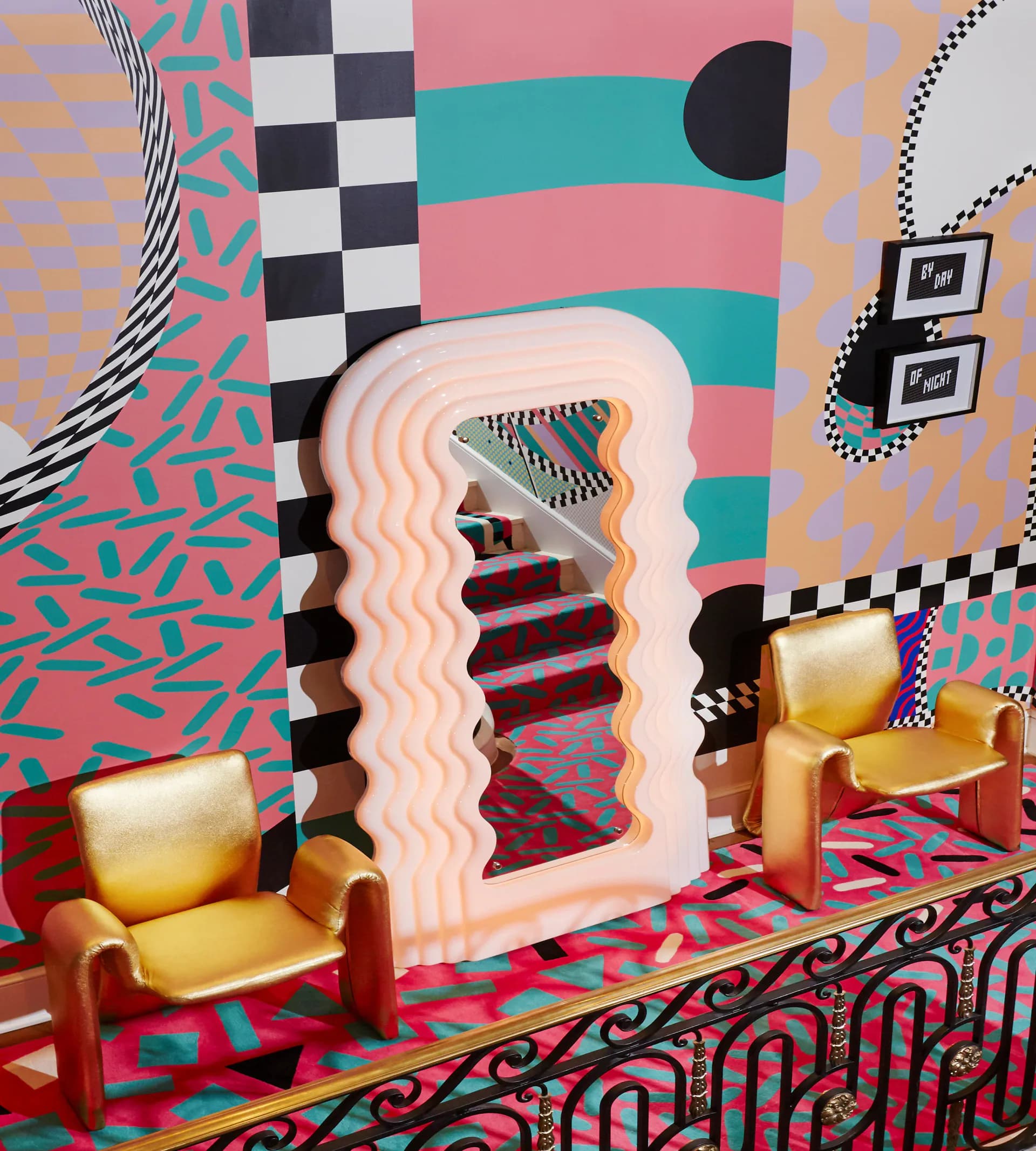 Vibrant maximalist interior with layered geometric patterns, pink and teal striped walls, checkerboard details, and surreal wavy architectural elements by Voutsa.