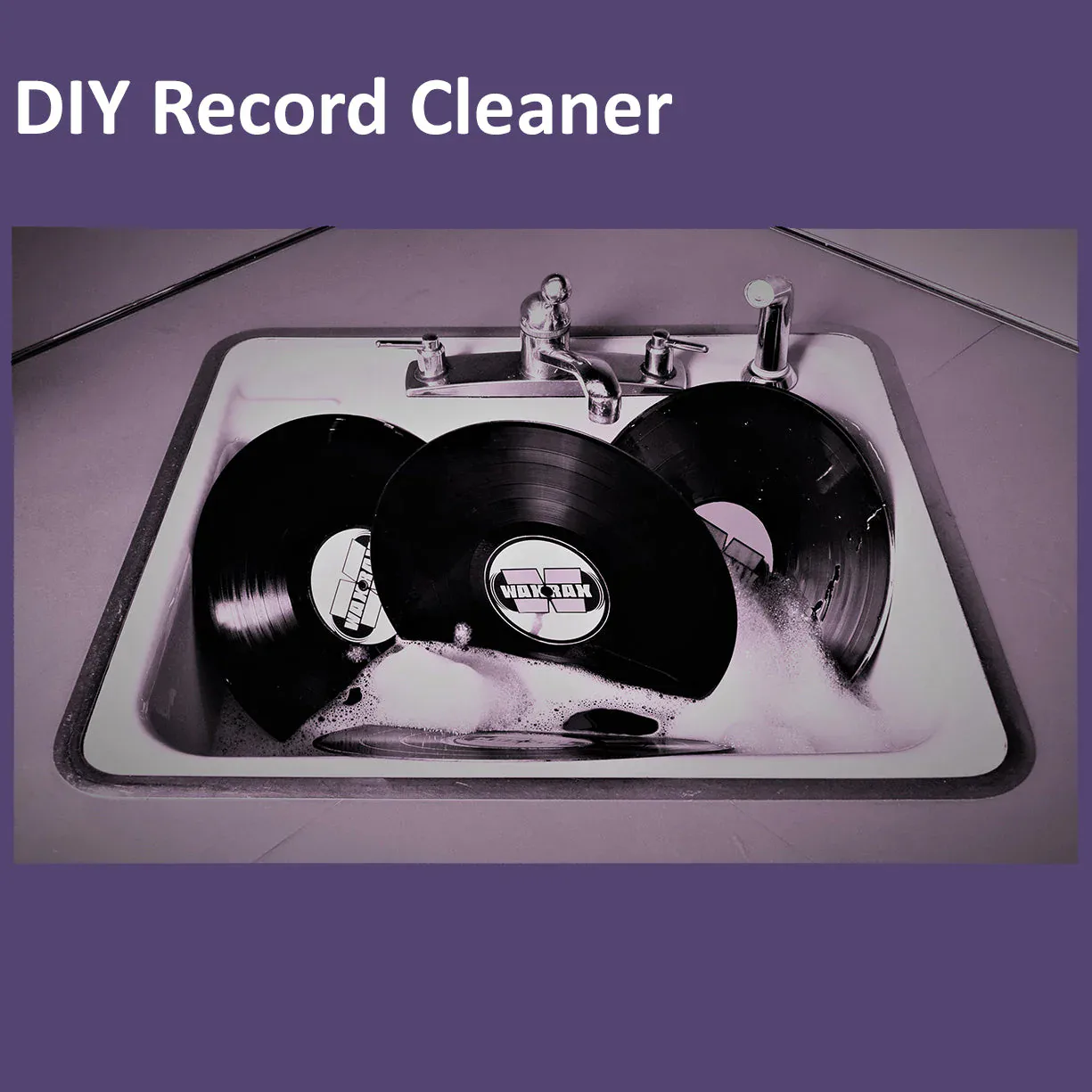 DIY record cleaner installation in a kitchen sink with vinyl records and faucet fixtures, designed by WAXRAX.