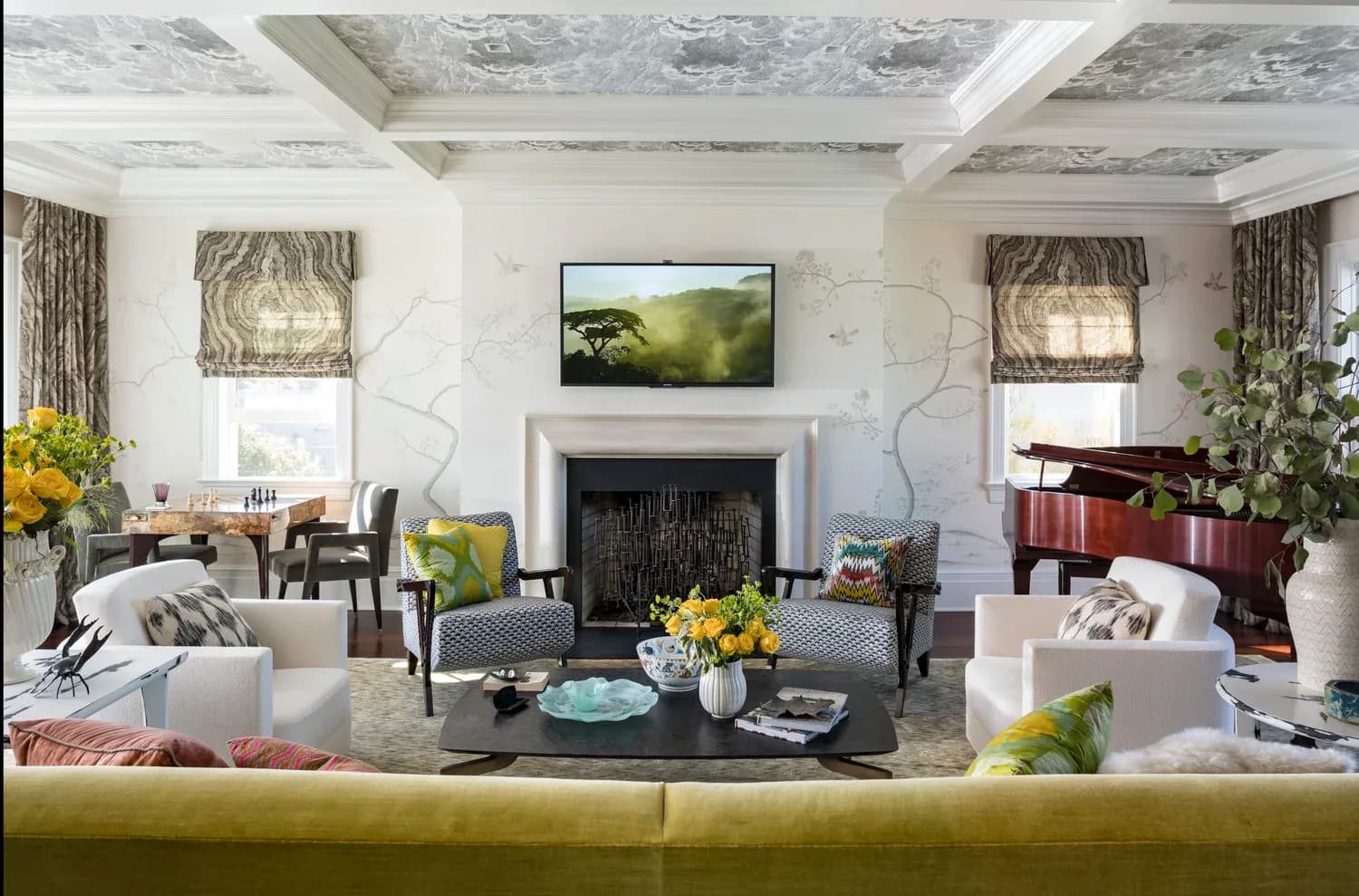 Elegant living room with marble fireplace, white seating, chartreuse sofa, exposed ceiling beams, and yellow accents throughout by Young Huh Interior Design.